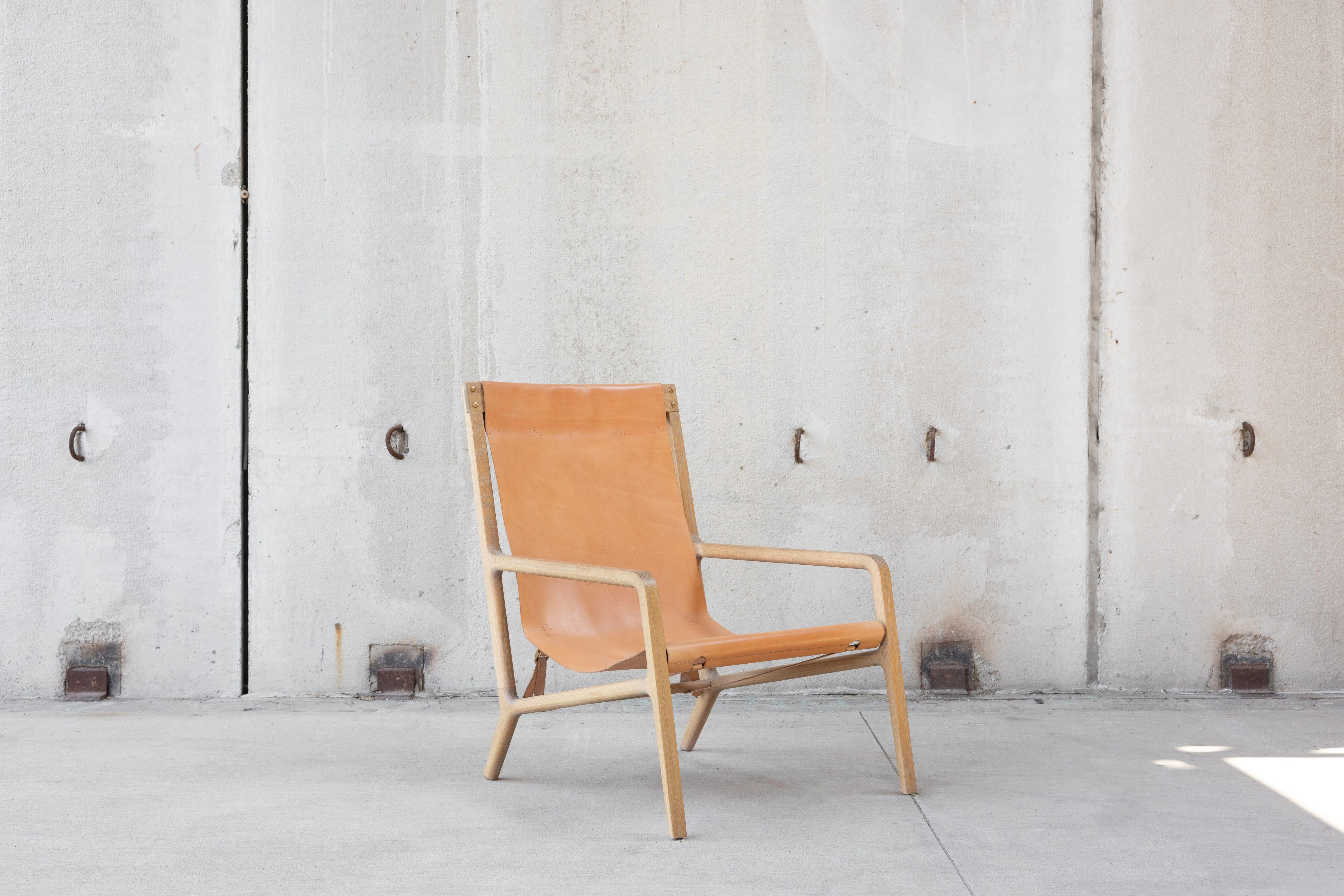 This leather lounge chair was made to make a dynamic appearance in any space and to be a go to lounge chair for reading and relaxing. The original design was built and tested over and over again making small changes to dimensions, construction