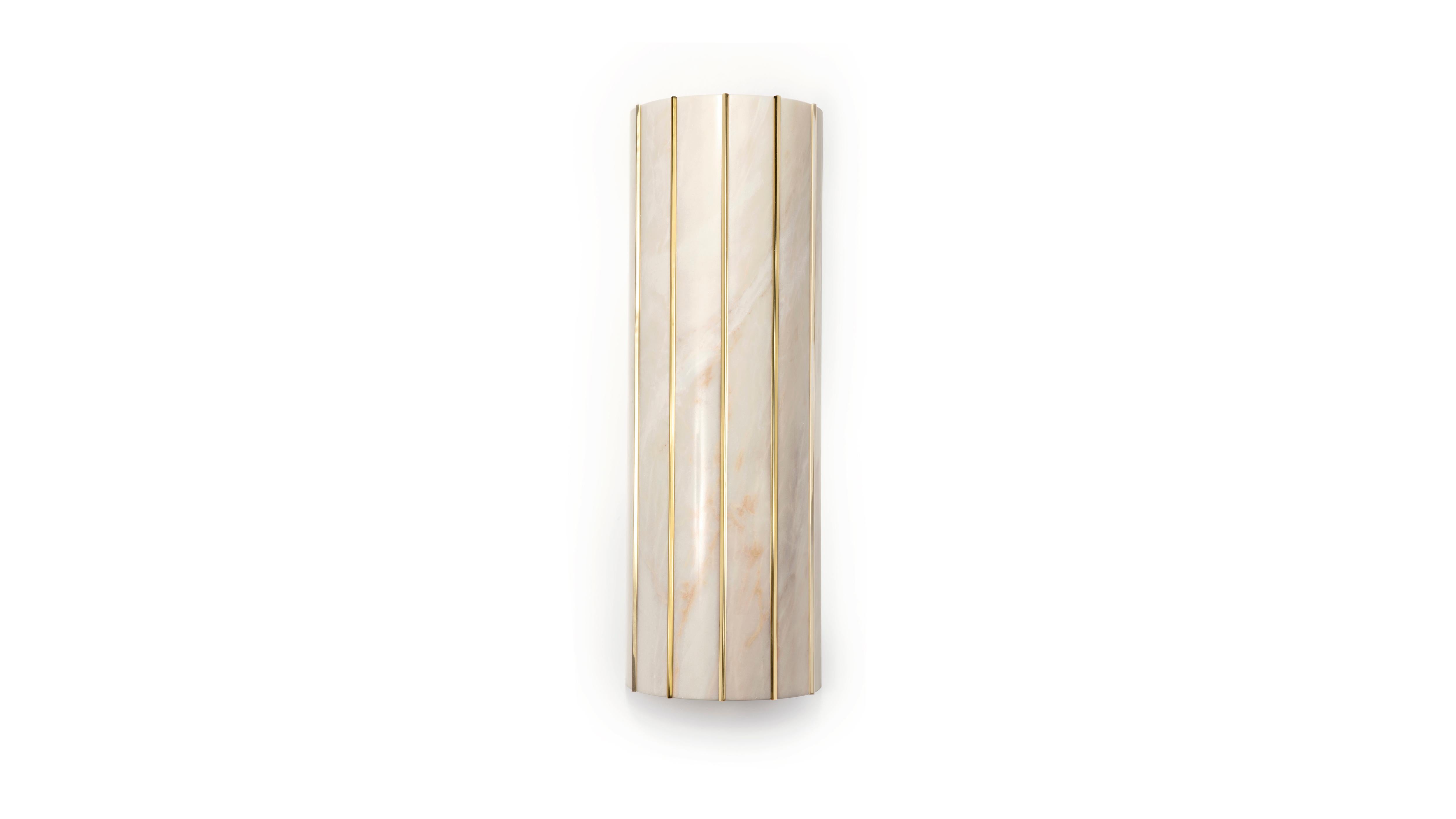 The marble alternates with polished brass in a cylindrical form. Handcrafted. Various marble and brass finishes are available.