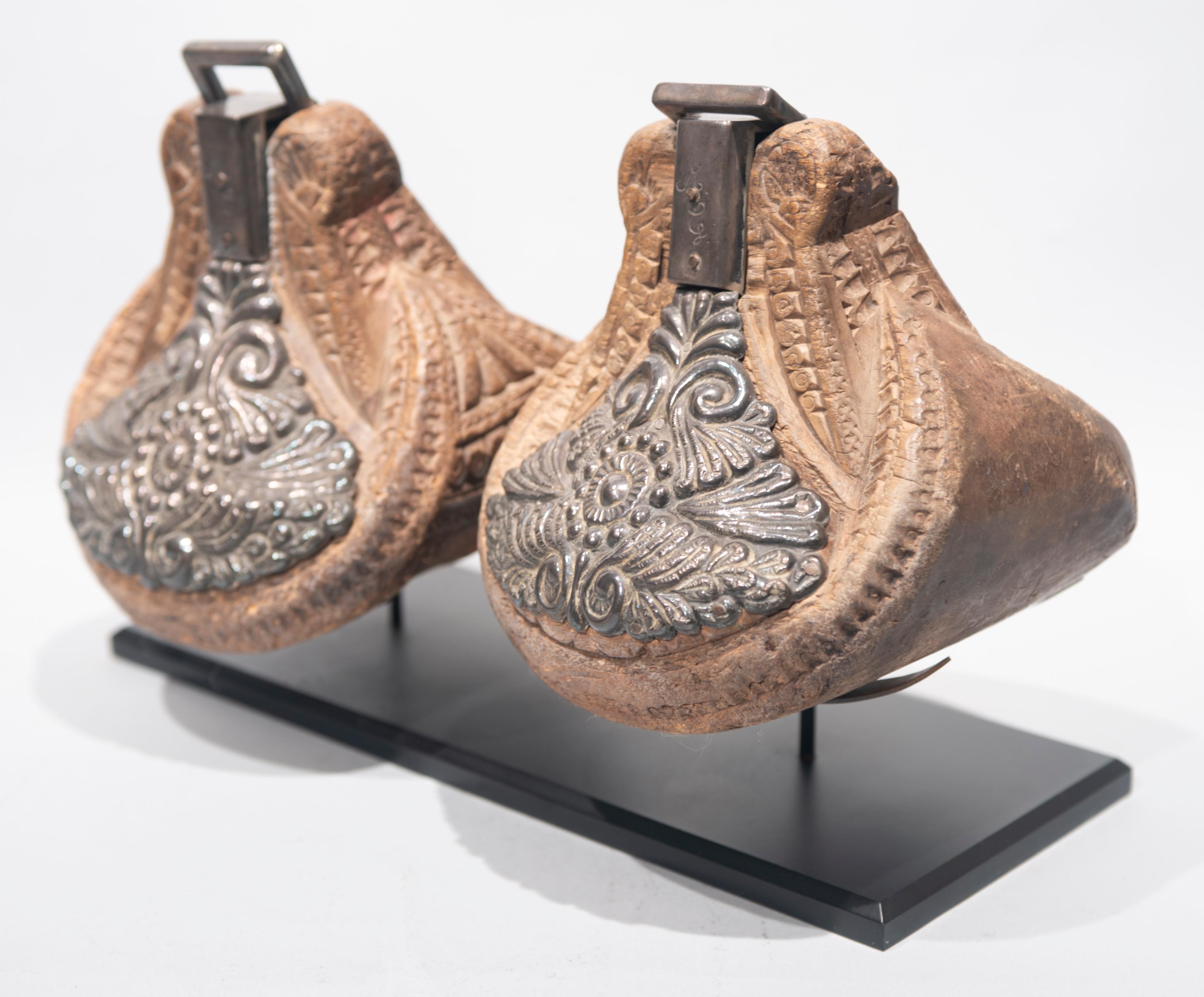 This pair of Mexican Estribos (stirrups) is made of wood decorated with silver. It comes to us from a private collection in Houston.