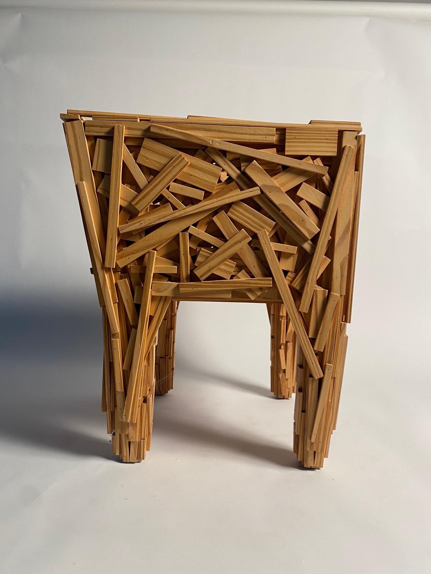 Built with pieces of natural Brazilian Pinus wood, fixed by hand in a deliberately random, the Favela armchair was designed by the now legendary Campana brothers (Humberto and Fernando) for the Italian firm Edra and constitutes one of their most