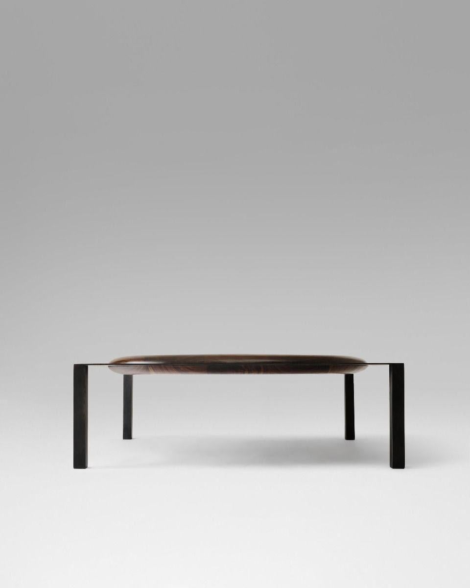 Coffee table in solid walnut and blackened steel.

Materials
Walnut and blackened steel, white oak and steel

Dimensions
40” W x 40” L x 16” H.

 