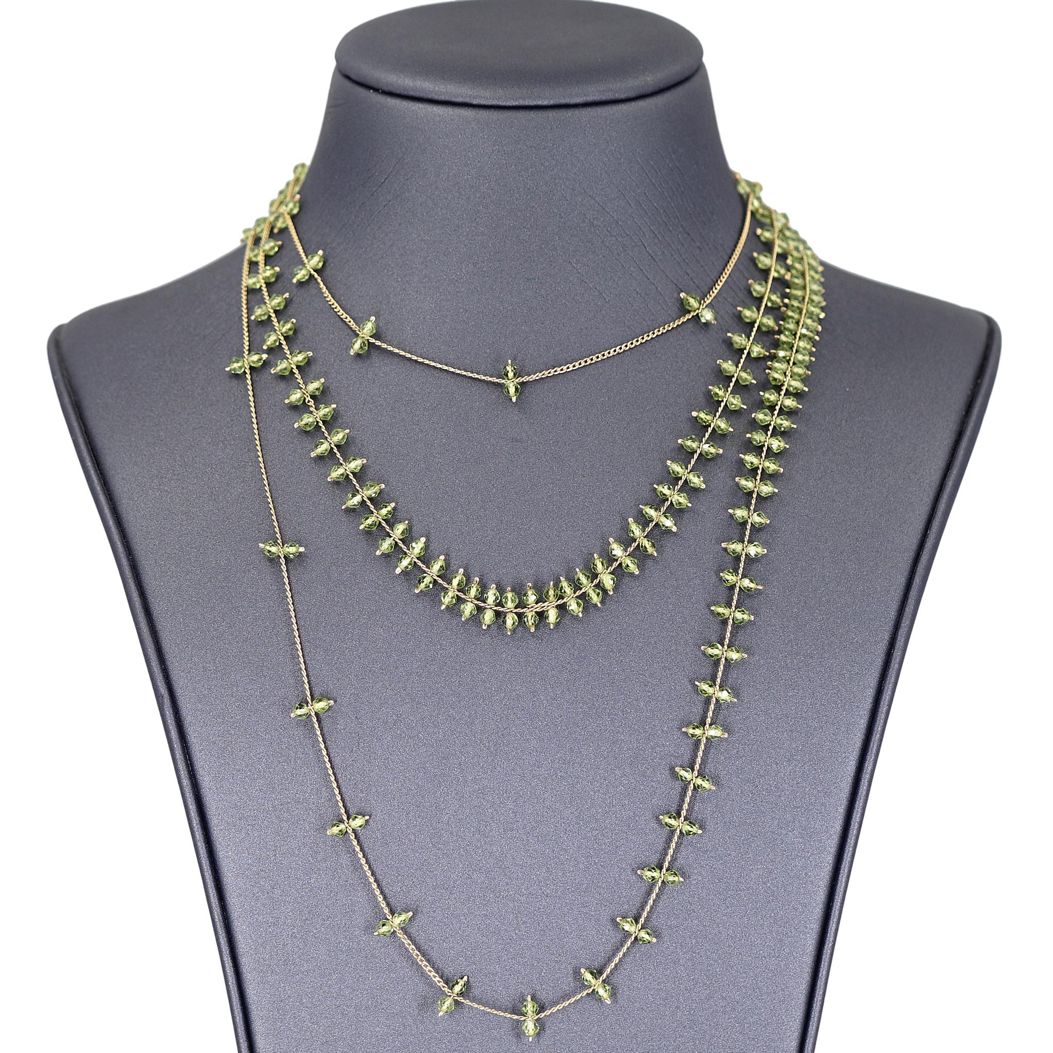 Rain Necklace hand-fabricated by jewelry maker Estyn Hulbert featuring a gorgeous double cascade of individually-set faceted peridot beads all strung on 50 inches of lustrous 14k gold-filled chain. Wearable at multiple lengths. 

About the Maker -
