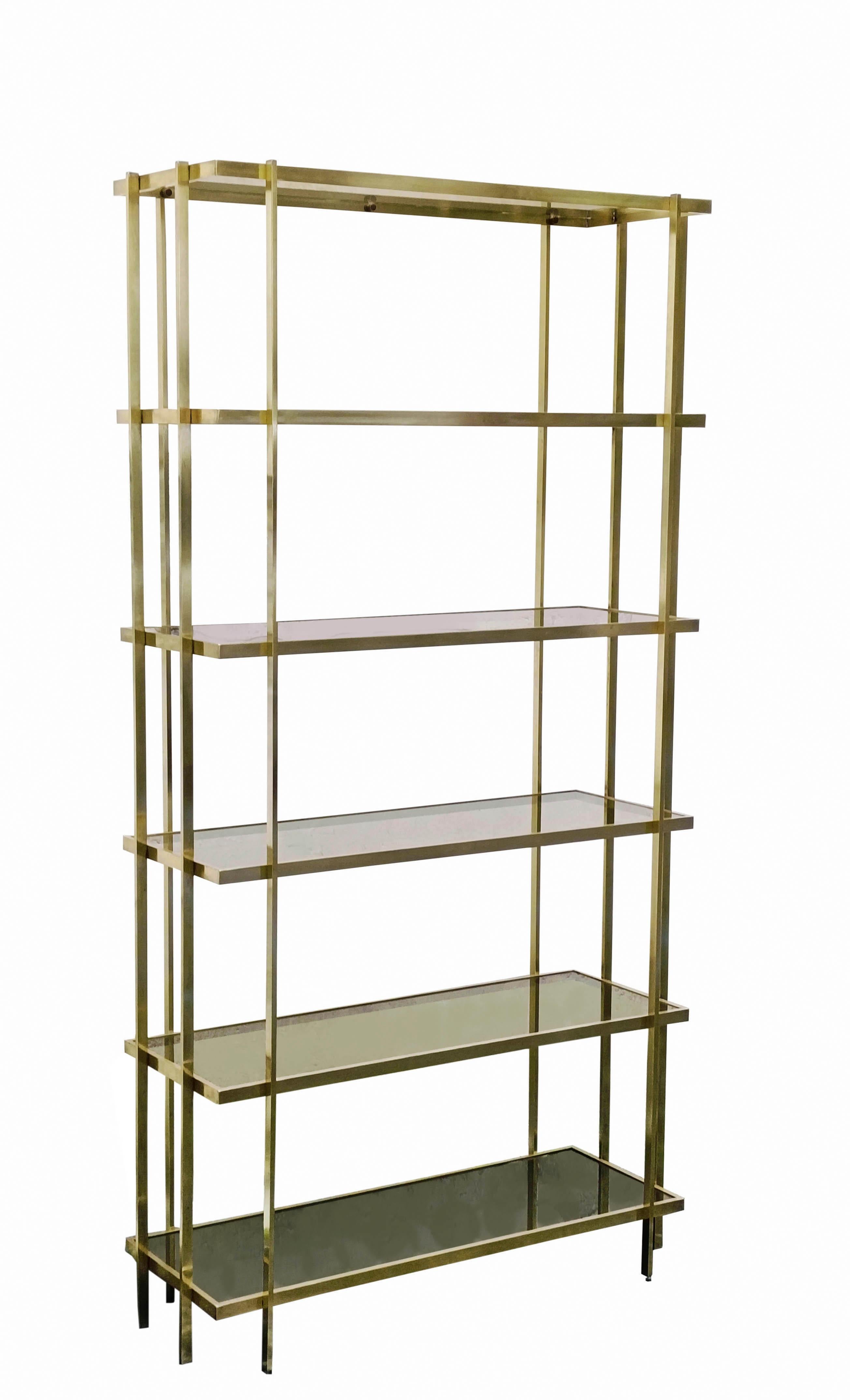 Etagere made entirely of  high-quality brass in a beautiful golden color, together with smoked glass that creates a wonderful luxurious style, also the bottom top is smoked mirrored. The straight shapes and subtle details create an outstanding