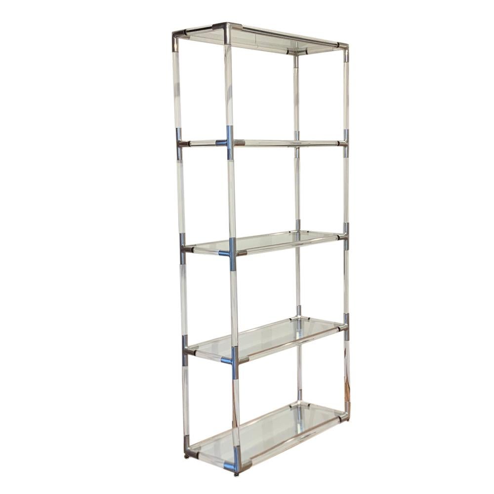 Etagere, Lucite, aluminum and glass. Tall free standing étagère with five glass shelves, clear acrylic frame and polished aluminum corner joints. It has great scale and a clean look. We used it in our space at the 1stdibs Gallery. Each shelf is