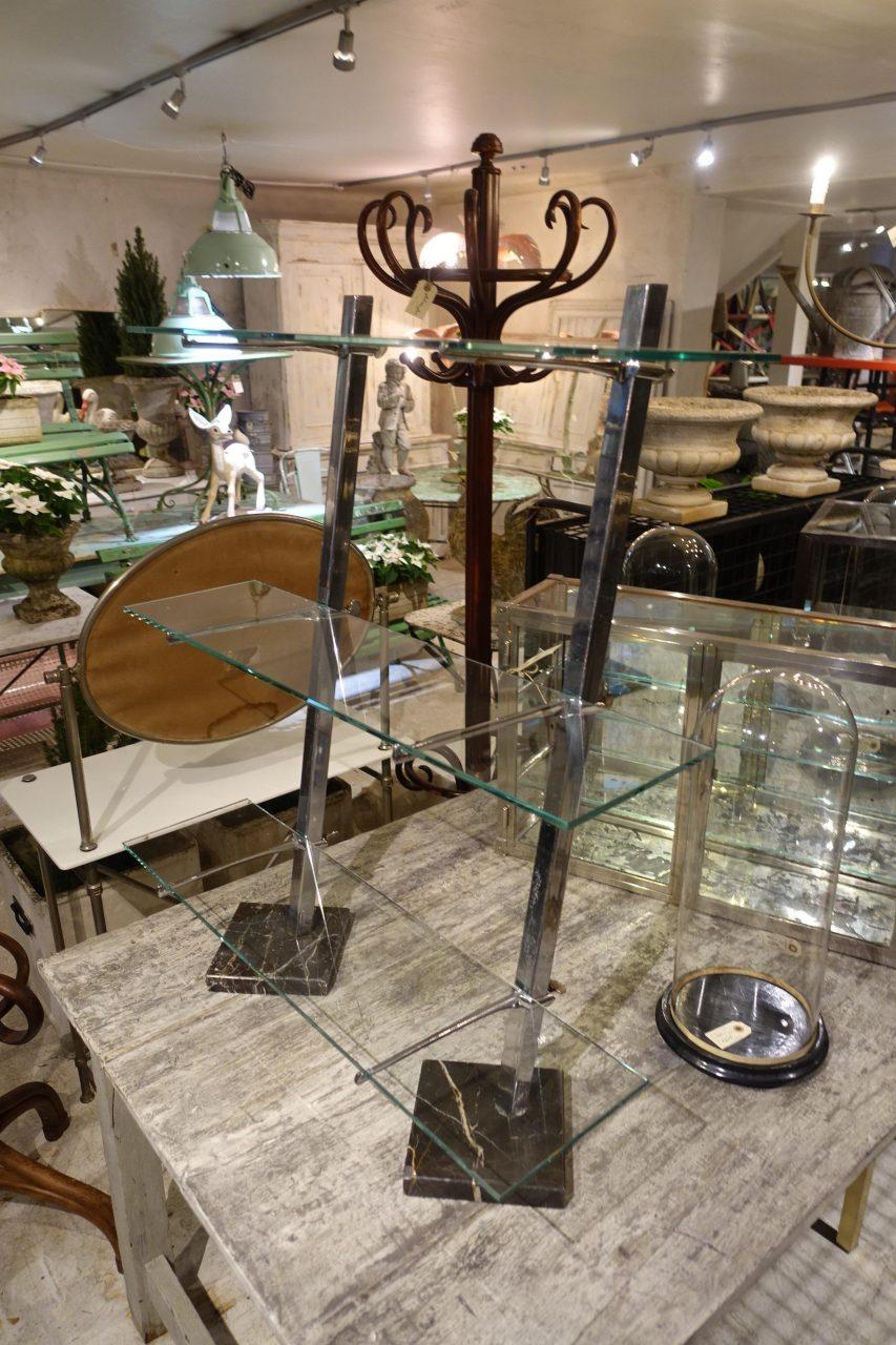 Vintage and charming étagère in chrome and glass. Super elegant Art Deco style from circa 1930s France. Originally boutique inventory in the South of France. This shelving stand consists of 2 beveled and chrome-plated metal rods mounted on 2 square