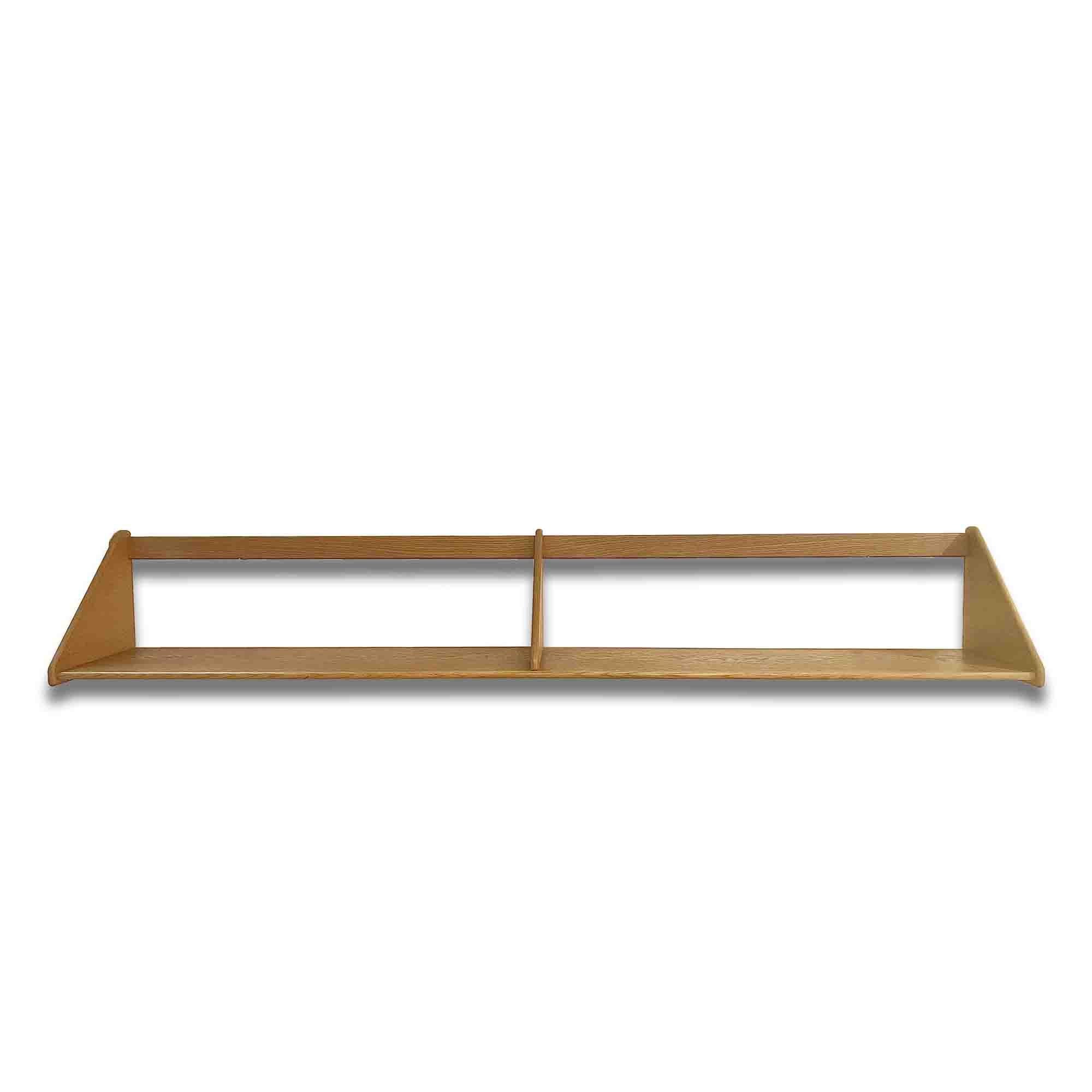 Practical and elegant, this solid oak wall shelf is one of Børge Mogensen's very first models. He designed the shelf while still a student at the Academy of Arts furniture school. The vintage, clean design is over 60 years old, but remains just as