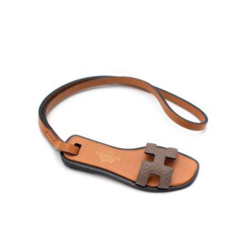 Hermes Brown Oran O Charm 
 
 Charm in Epsom and Butler calfskin and Hunter cowhide with 