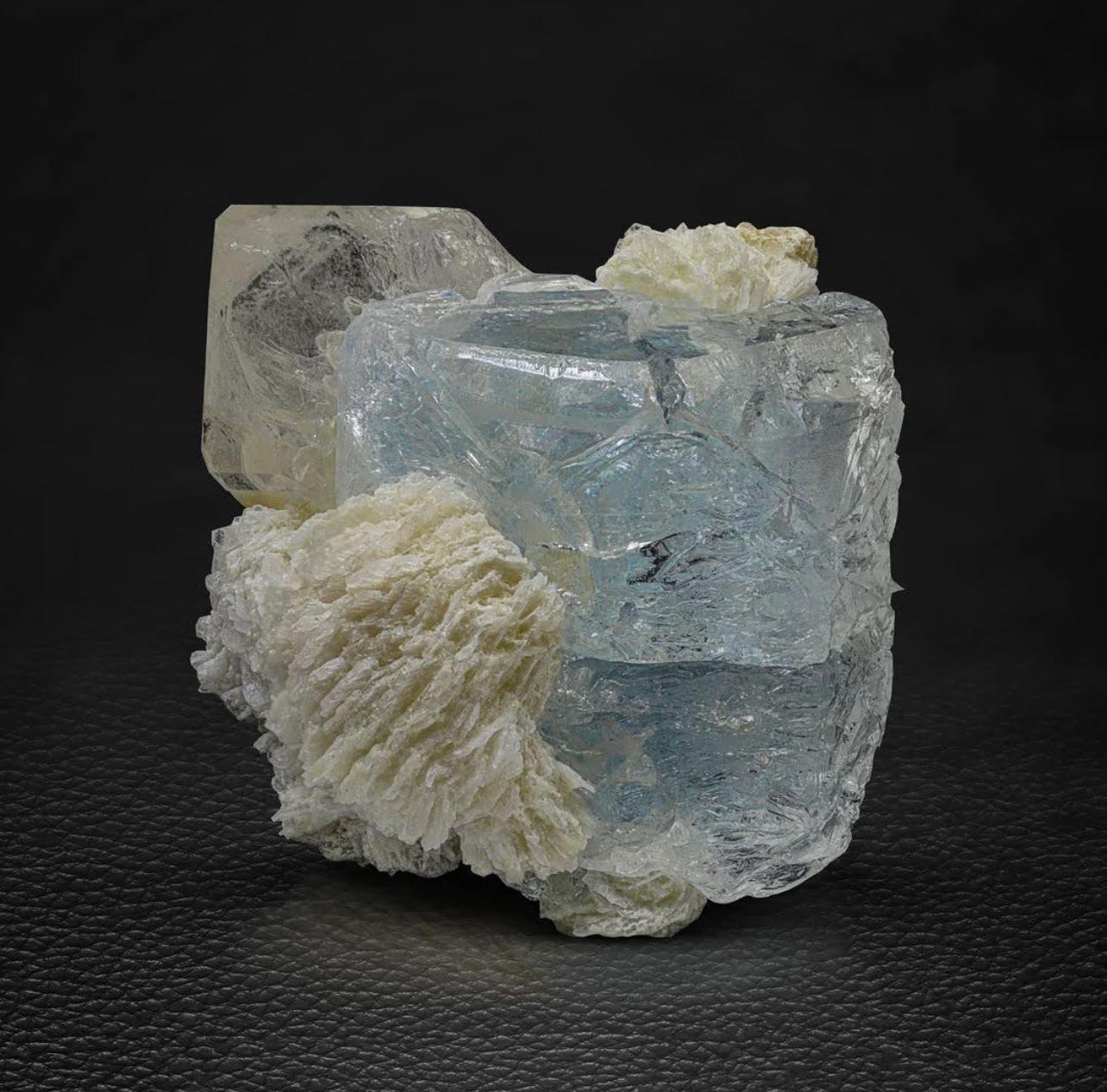 Product Information:

Specimen Name: Aquamarine with Quartz

Weight: 131 grams

Dimensions: H: 5.2 x W: 5 x D: 5.2 cm

Treatment: None

Locality: Shigar Valley, Skardu District, Gilgit Baltistan Province, Pakistan

Description: 

This striking