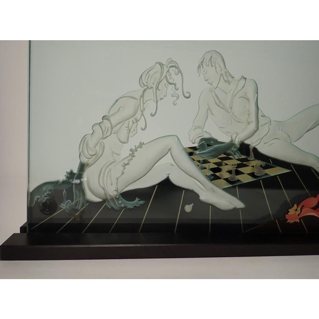 Reverse relief etched and painted mounted art glass panel depicting a man and a woman playing chess. Signed 