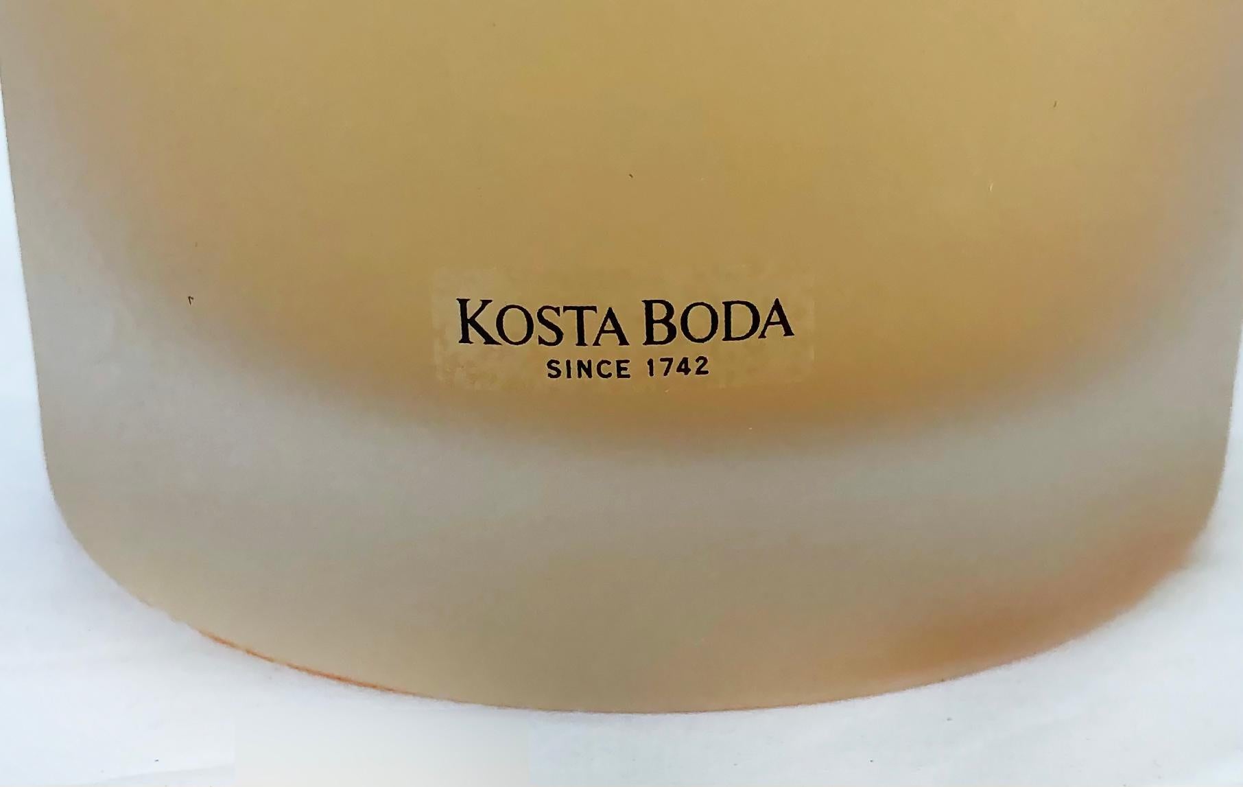 Offered for sale is a vintage etched art glass vase by Olle Brozen for Kosta Boda. The vase is signed and numbered and retains the original label as shown. 

Measures: 11.25