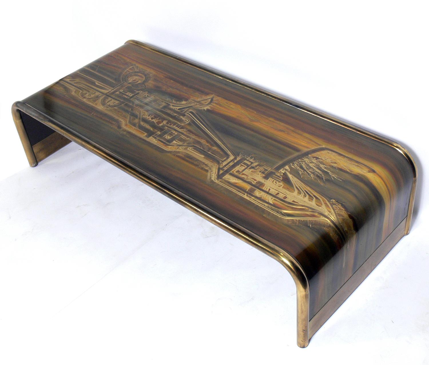 Etched Brass Waterfall Coffee Table by Bernhard Rohne for Mastercraft, American, circa 1960s. Sculptural waterfall form with abstract etched designs throughout. Retains warm original patina.