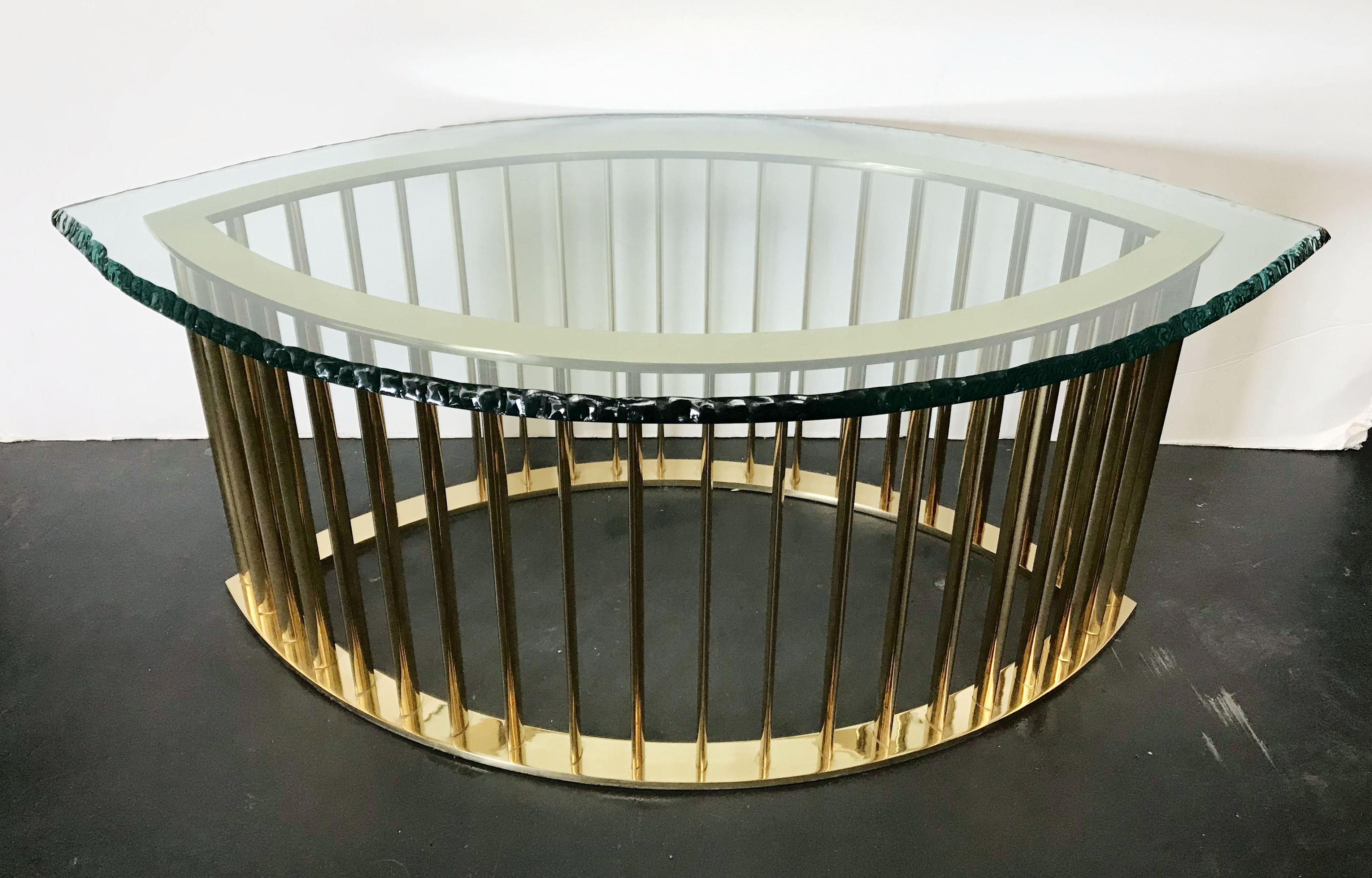 Limited edition coffee table with thick etched glass top and polished brass base with elegant oval shaped vertical bars / Exclusively designed by Gianluca Fontana for Fabio Ltd / Made in Italy
Measures: width 47 inches / depth 28 inches / height 18