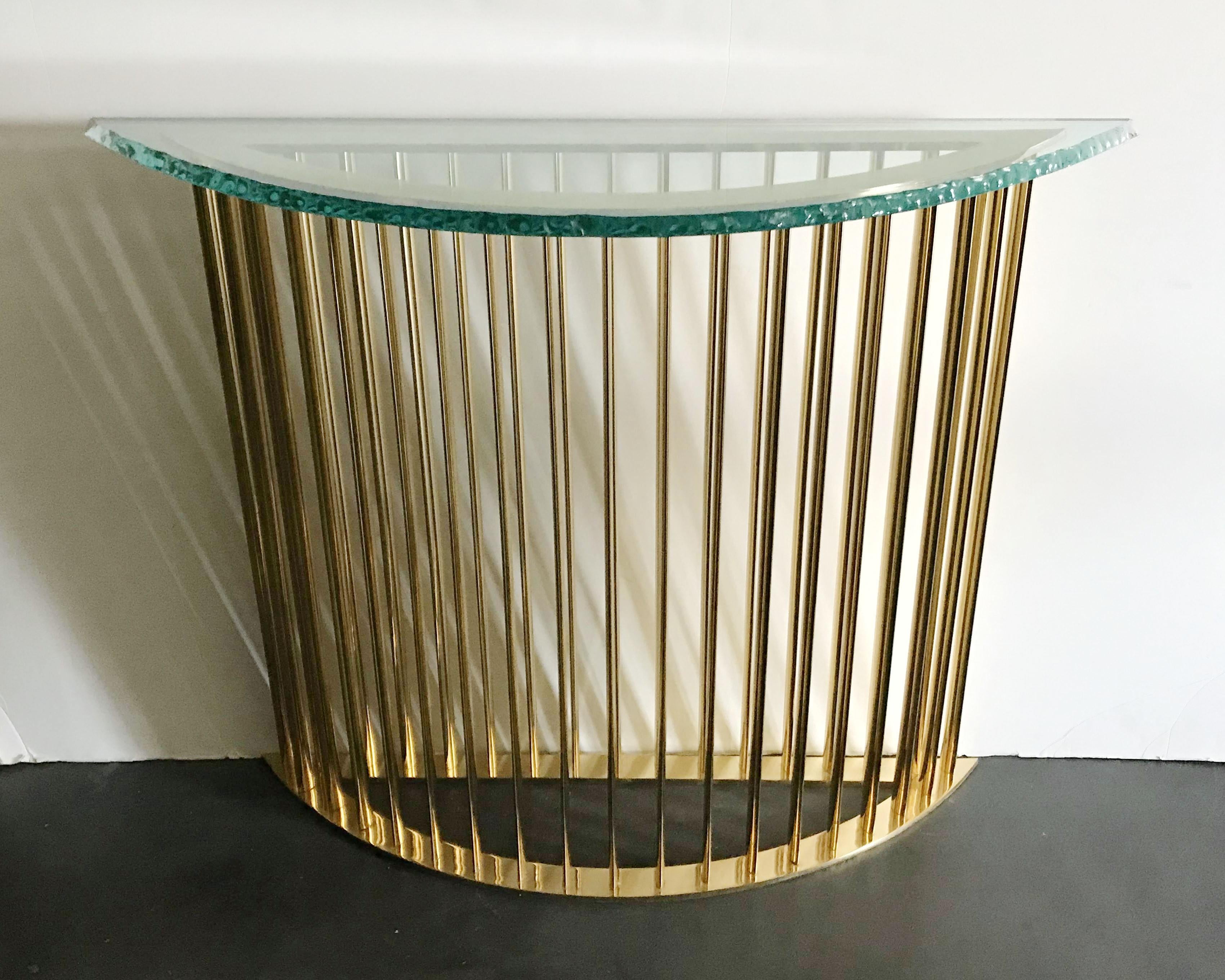 Limited edition console table with thick etched glass top and polished brass base with elegant oval shaped vertical bars / exclusively designed by Gianluca Fontana for Fabio Ltd / Made in Italy
Measures: Width 47 inches, depth 14 inches, height 35.5