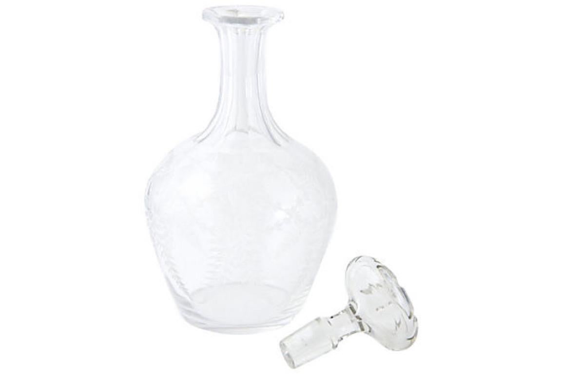 Crystal decanter hand-etched with flower and leaf design. Waterline inside at bottom.
 