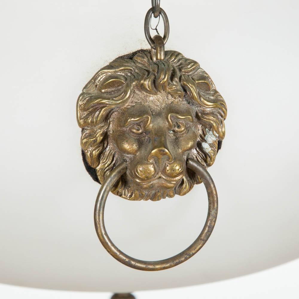 An Edwardian etched white glass hanging light with bronze lions head fittings.

The light can be hung with chains of any length suitable to the proportions of the interior in which it would be fitted.

The dimensions are for the glass light. The
