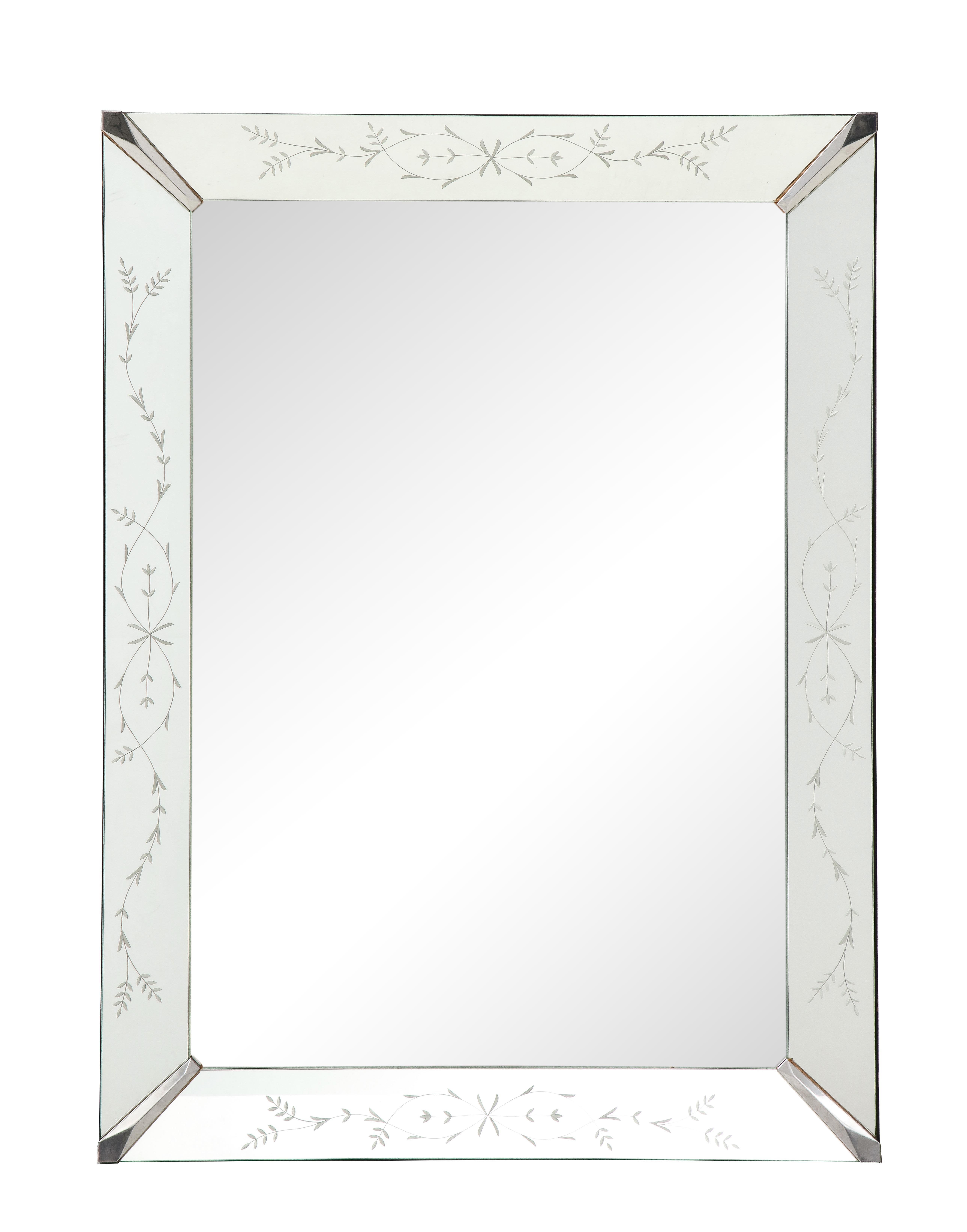 A wonderful etched glass mirror with floral motif is simple in design and elegant in style. Four nickel plated corners angle the etched mirrored frame securely.