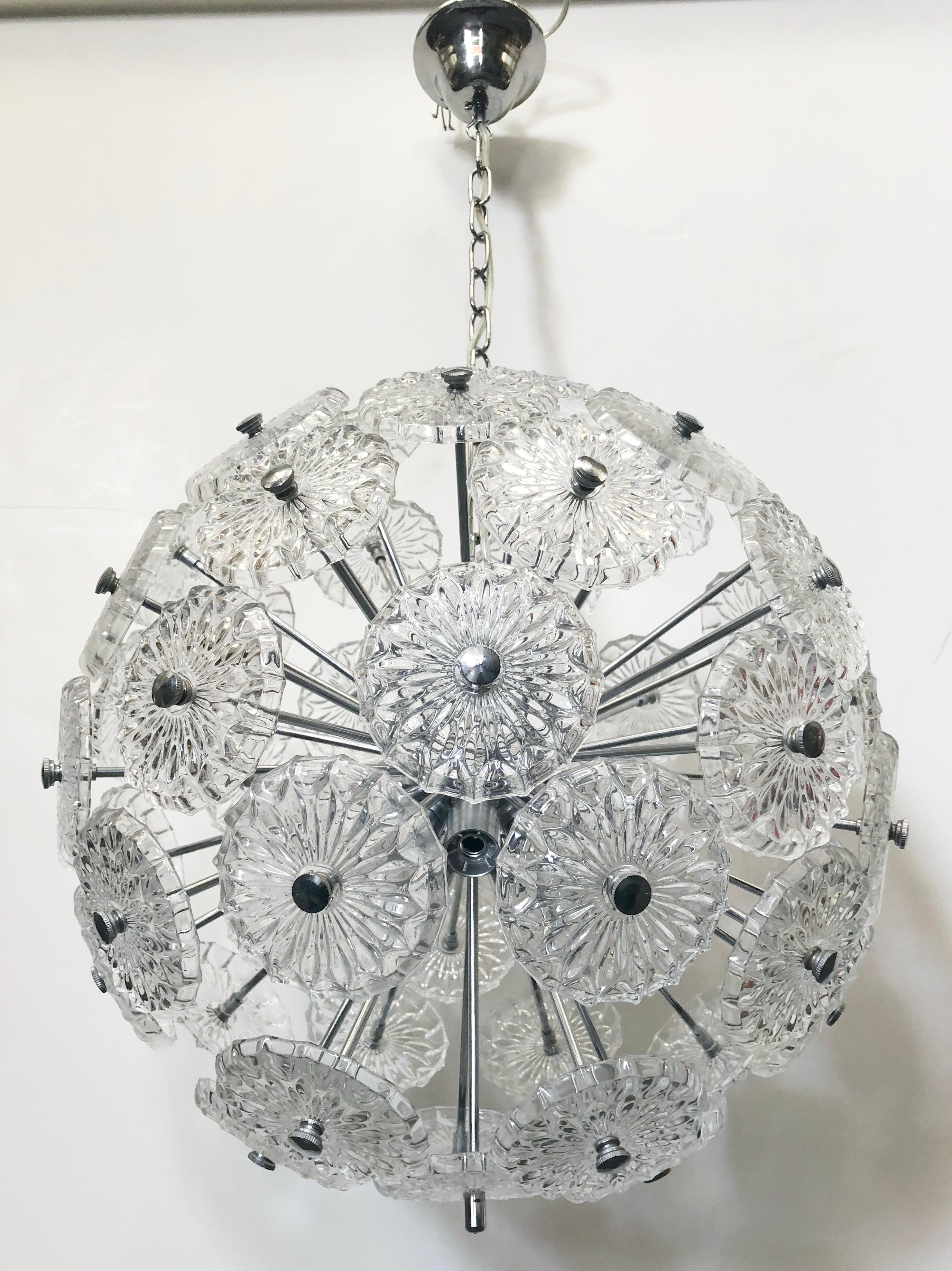 Vintage Italian Sputnik chandelier with clear etched glasses detailed and textured with geometric designs, mounted on chrome frame / Made in Italy circa 1960's
10 lights / E12 or E14 type / max 40W each
Diameter: 16 inches / Total Height: 33 inches