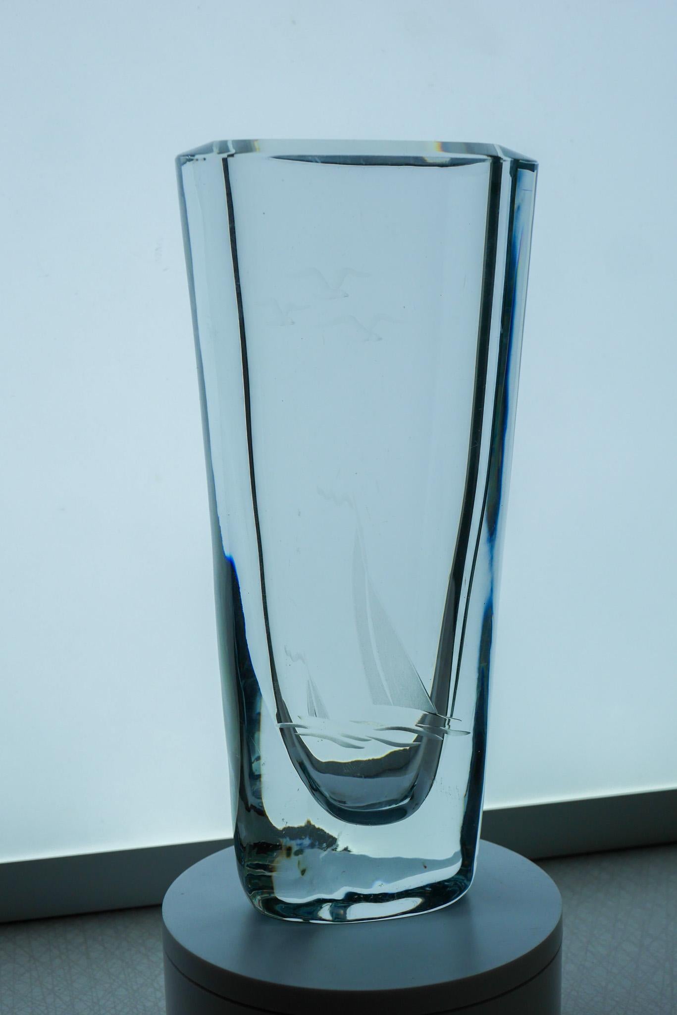 A handblown and etched vintage art glass vase with a Nautical or Sailing theme, design Asta Strömberg from the prestigious Strömbergshyttan Sweden. This vase has simple decor, on one side it has been etched with great precision a stylized sailing
