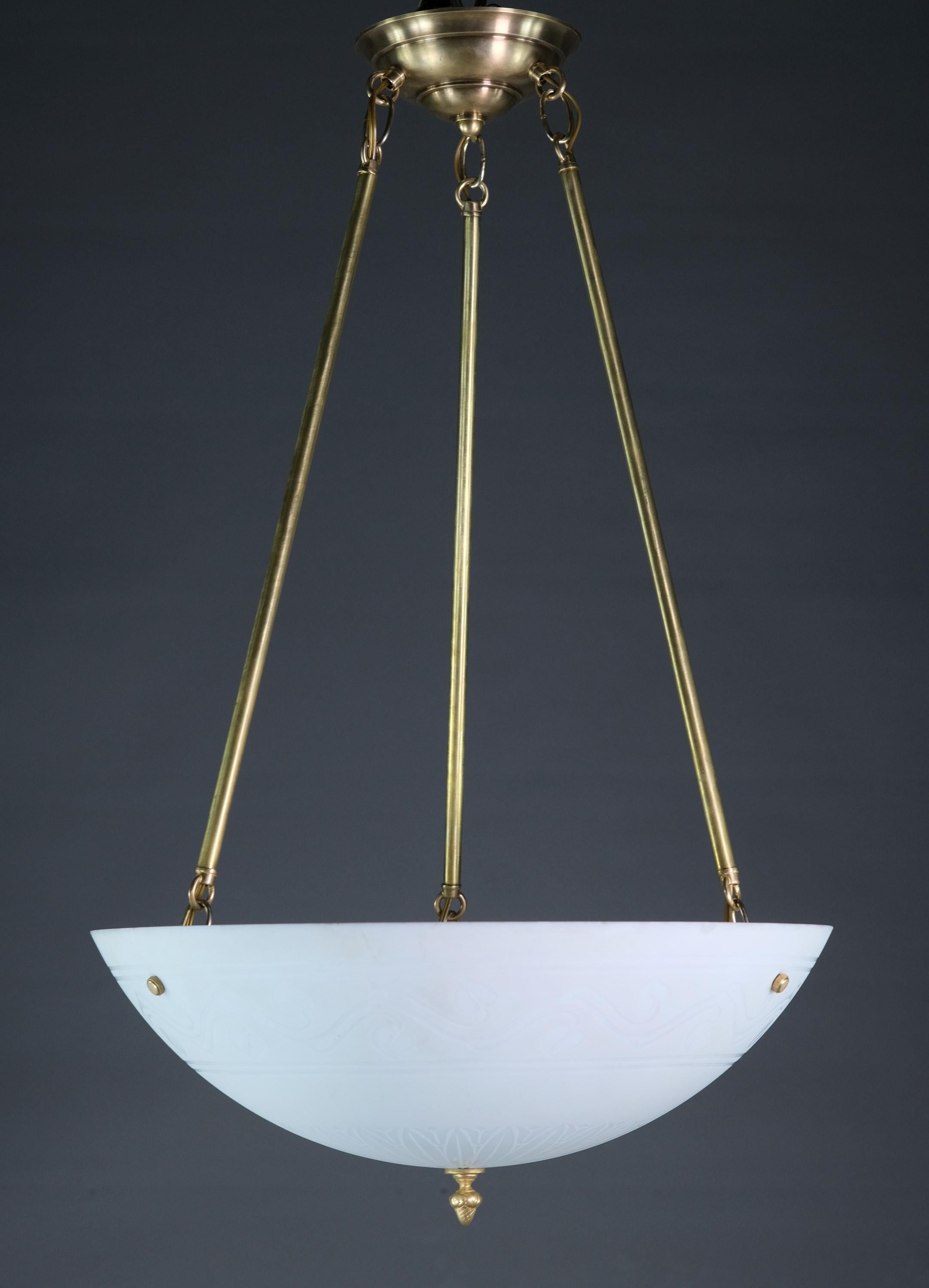 Rewired and restored 20th century pendant light. Featuring a while glass dish shade with three pole supports and matching canopy. Dish has leaves etched around the outside rim. Takes three E26 standard household lightbulbs.