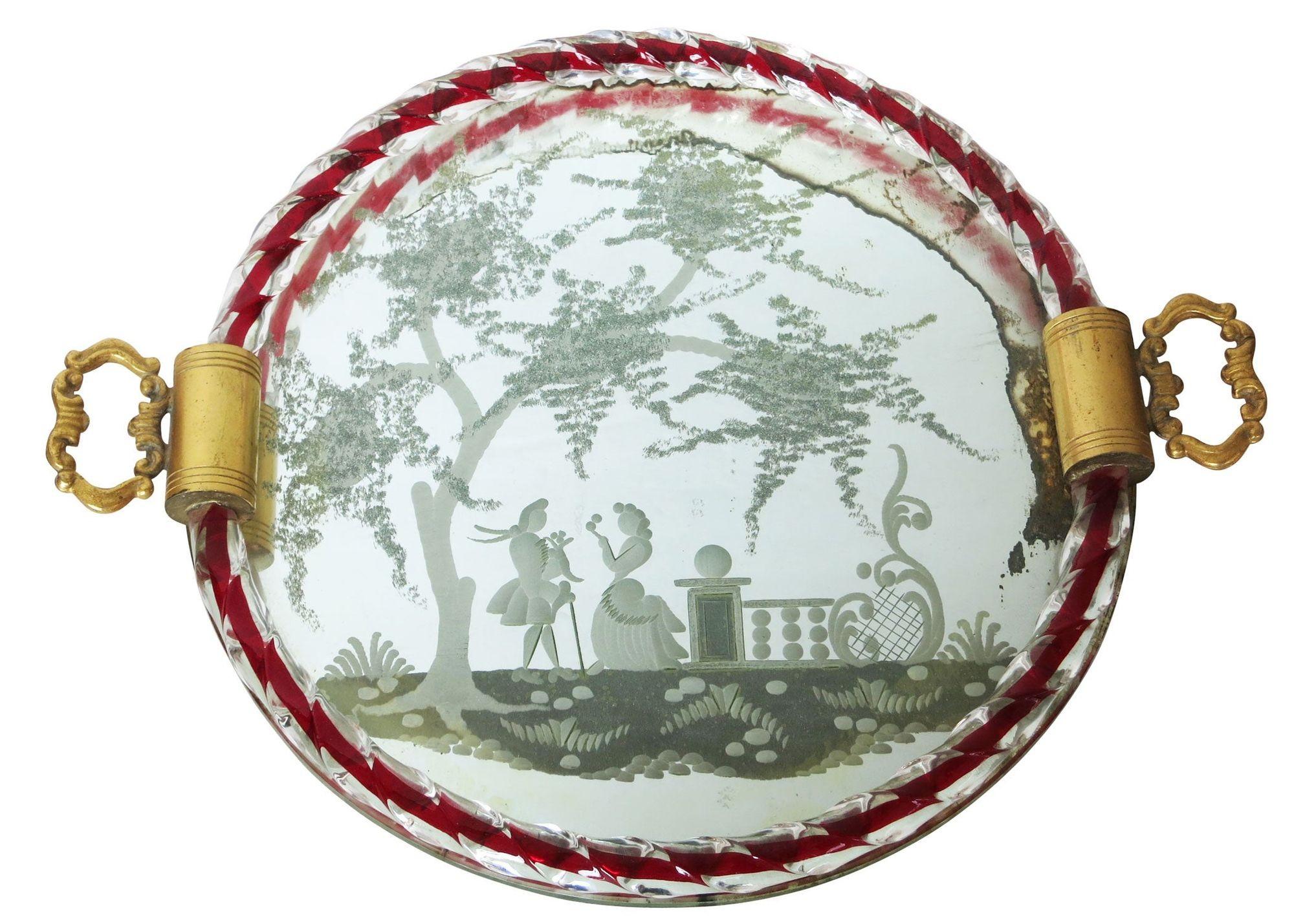 Created by Ercole Barovier, this piece is a beautiful Italian serving or vanity table tray edged in Murano glass rope that is embedded with red. Done in the style of Luigi Brusotti and Gio Ponti, the mirror is etched with Venetian romantic figures