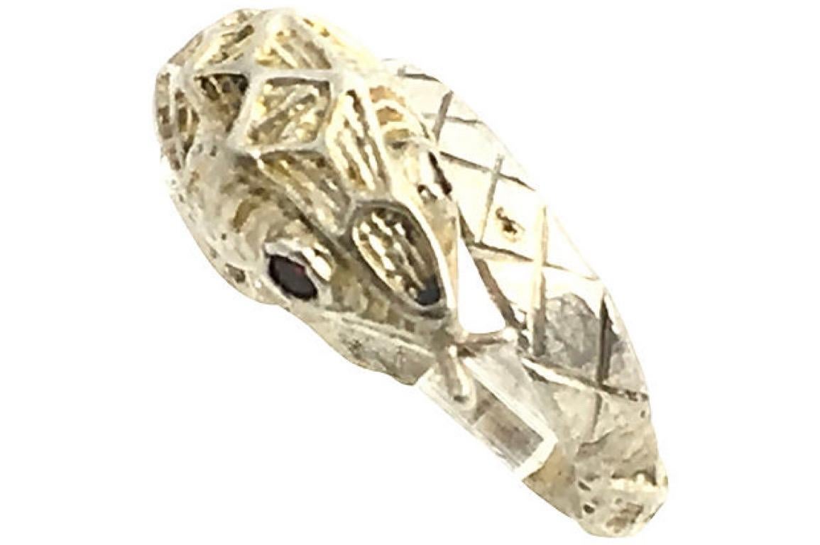 Etched sterling silver snake ring set with garnet eyes. 

Size: 7.5.