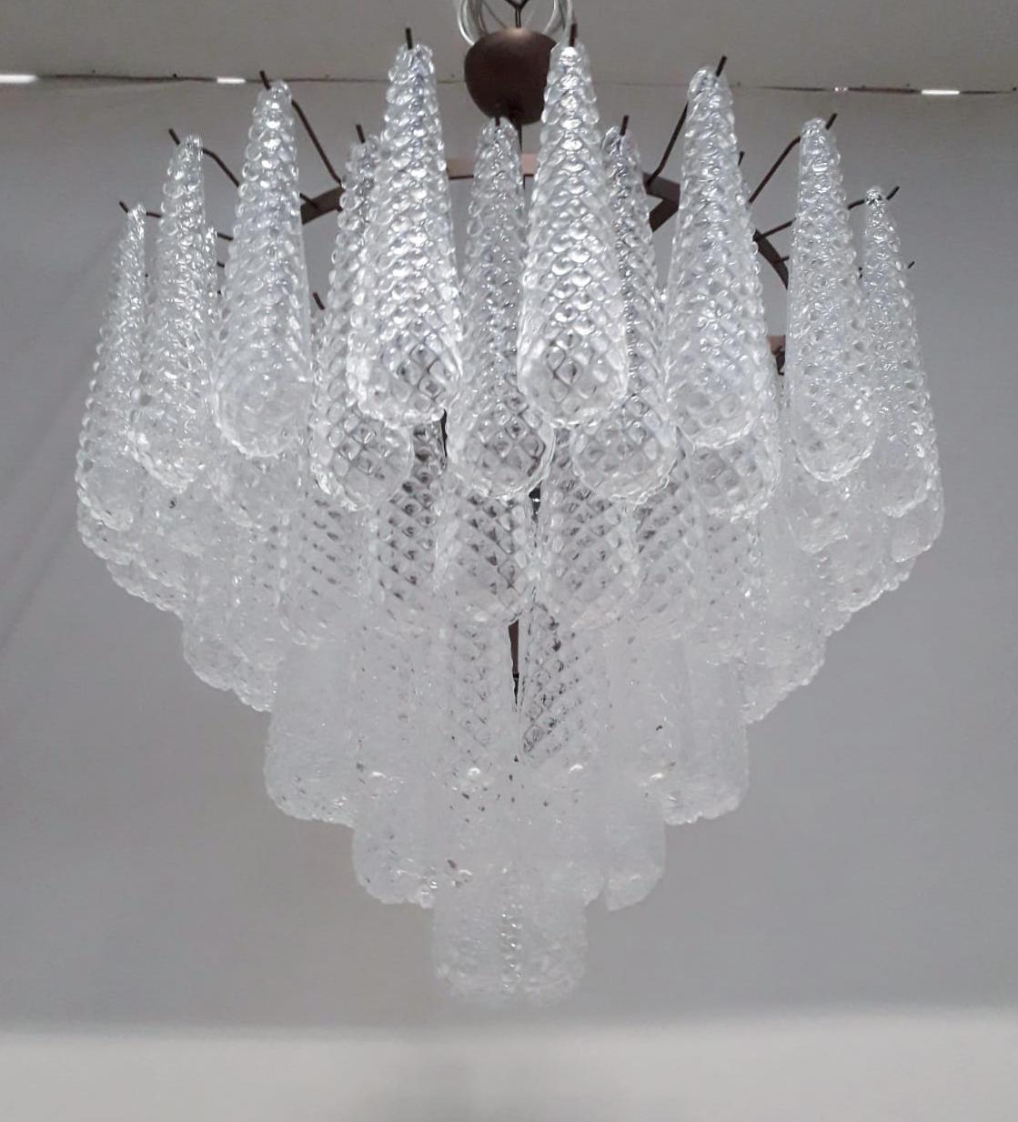Italian chandelier shown with hand blown Murano etched tears glass drops, mounted on bronzed metal finish frame by Fabio Ltd / Made in Italy
10 lights / 9 in E26 or E27 type, max 60W each and 1 in E12 or E14 type, max 40W
Measures: diameter 31.5