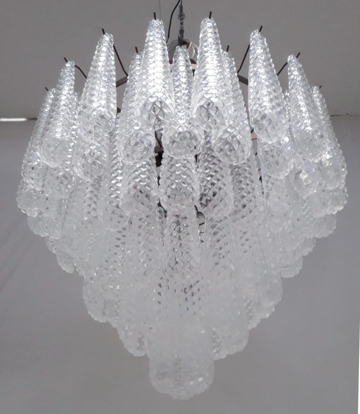 Italian chandelier shown with hand blown Murano etched tears glass drops, mounted on bronzed metal finish frame by Fabio Ltd / Made in Italy
10 lights / 9 in E26 or E27 type, max 60W each and 1 in E12 or E14 type, max 40W
Measures: Diameter 31.5