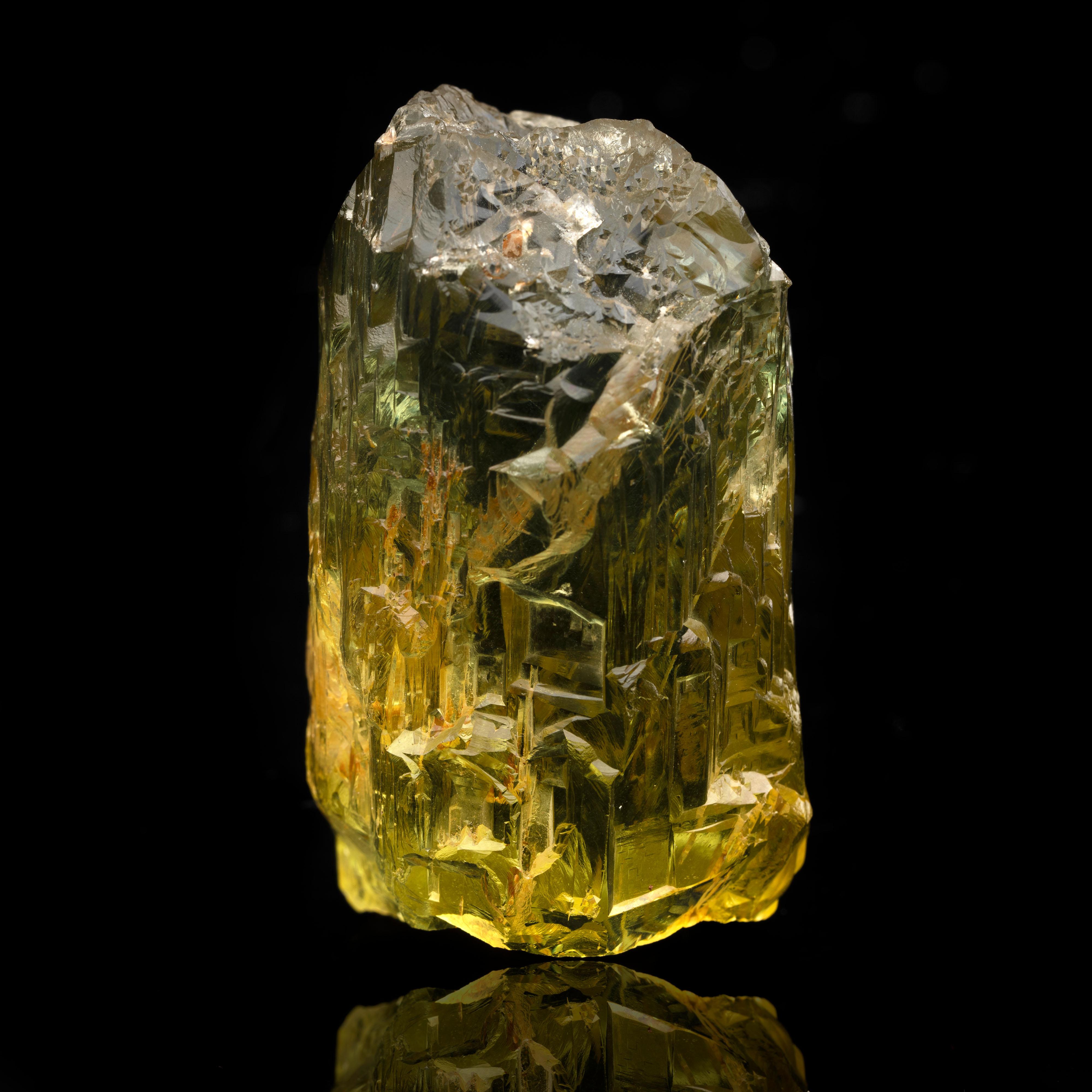 Discover the beauty of mineralogy at is finest with this rare Ukrainian heliodor. This exquisite greenish-yellow 144 gram specimen features excellent clarity and the characteristic natural etching adds exquisite detail. This AAA specimen will make a
