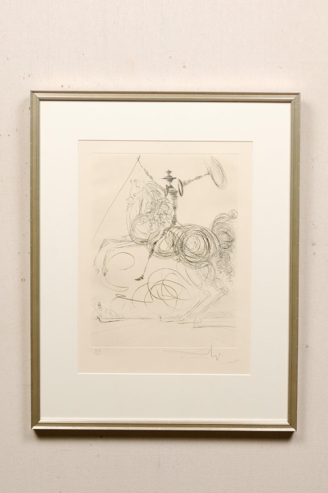 An etching of Salvador Dali's Don Quichotte (Horseman), a signed and numbered edition, presented within a custom silver frame. This sketch by Salvador Dali (Spain, 1904-1989), perhaps the world's most prominent surrealist artist, depicts the famous