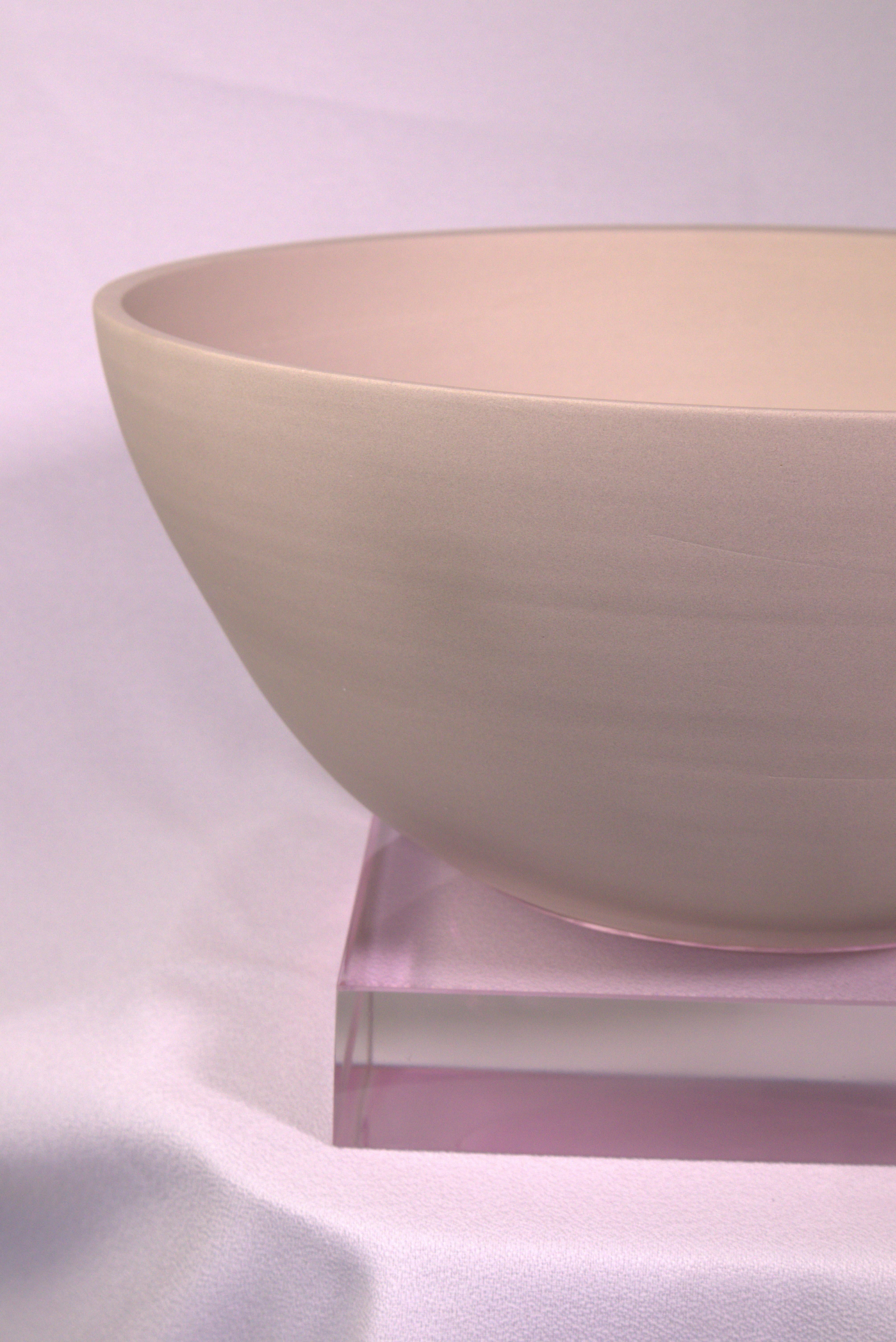PEANA 002 is a collectible object that embodies the quiet tension between raw material and refined form. Crafted entirely by hand, its base is shaped from Peruvian clay—turned using traditional methods passed down through generations. Resting atop