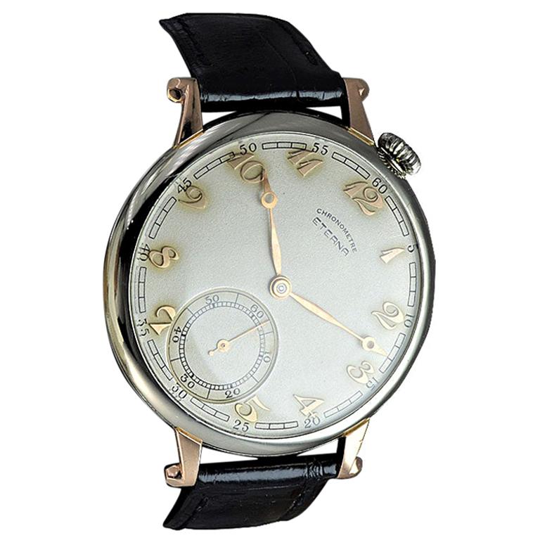 FACTORY / HOUSE: Eterna Watch Company
STYLE / REFERENCE: Art Deco / Oversized Pocket Wrist Watch
METAL: 18Kt. White Gold with Rose Gold Lugs
CIRCA / YEAR: 1930's
MOVEMENT / CALIBER: Manually Wound / 17 Jewels / High Grade Swiss Made
DIAL / HANDS: