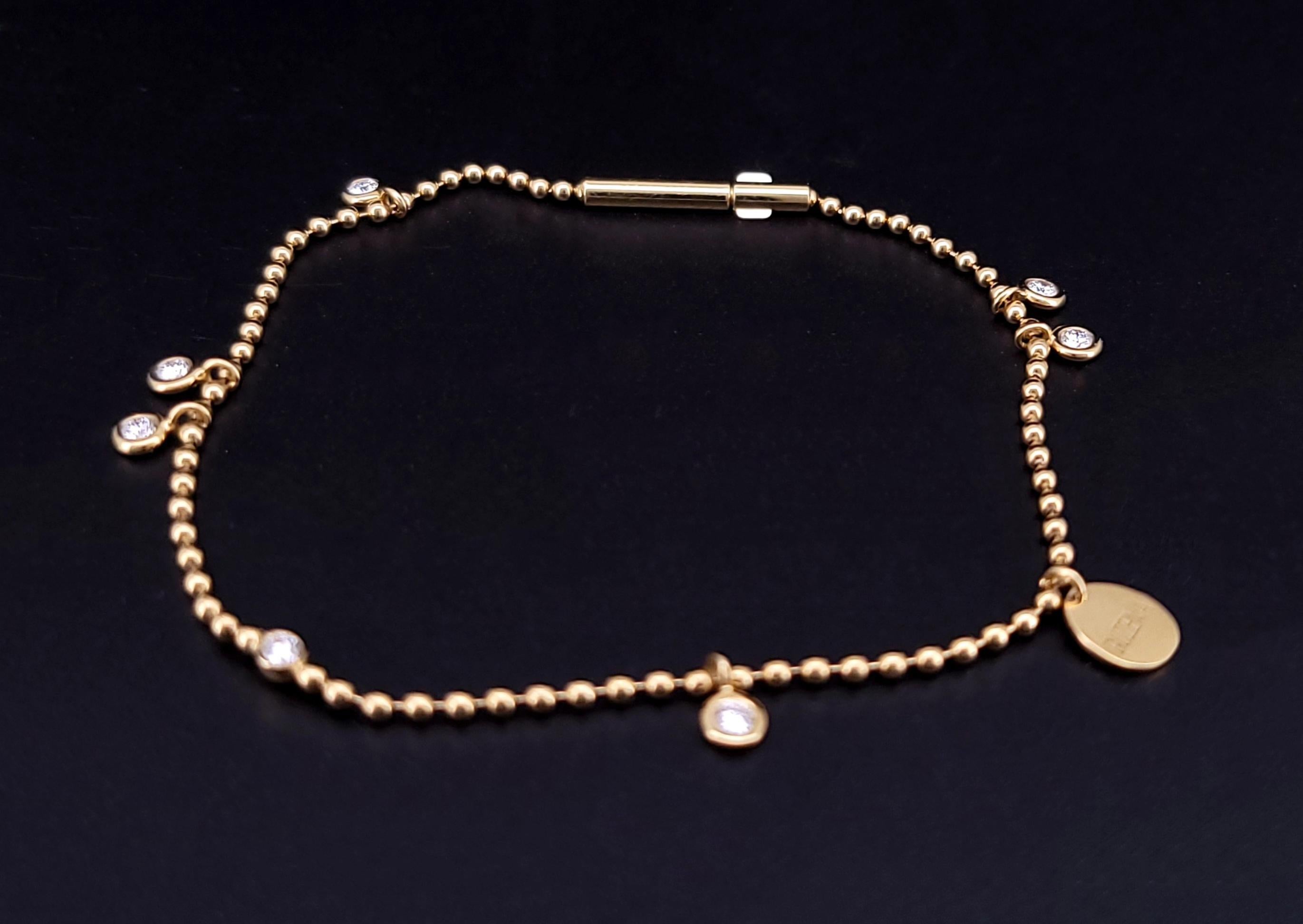 Bracciale a catena a sfere Eternal Collection'S con diamanti
Materiale Oro giallo 18 carati
Si adatta a polsi fino a 6 1/4''.
Peso del braccialetto: 2,5gr
Diamante: 0,205 ct. 
Chiarezza del diamante: VVS 
Grado di colore: D. A.
Condizione: Nuovo