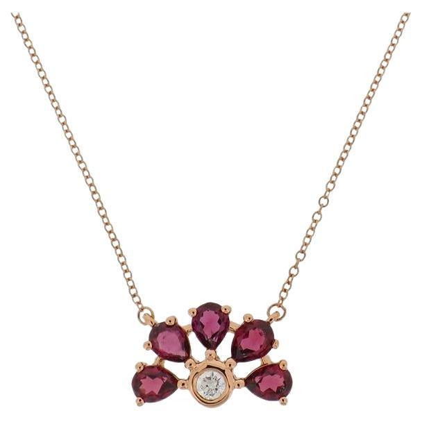 14K Rose Gold Ring (Matching Earrings and Necklace Available)

Diamond 1 - 0.062cts

Garnet 5 -  1.01cts
Size 52

With a heritage of ancient fine Swiss jewelry traditions, NATKINA is a Geneva based jewellery brand, which creates modern jewellery
