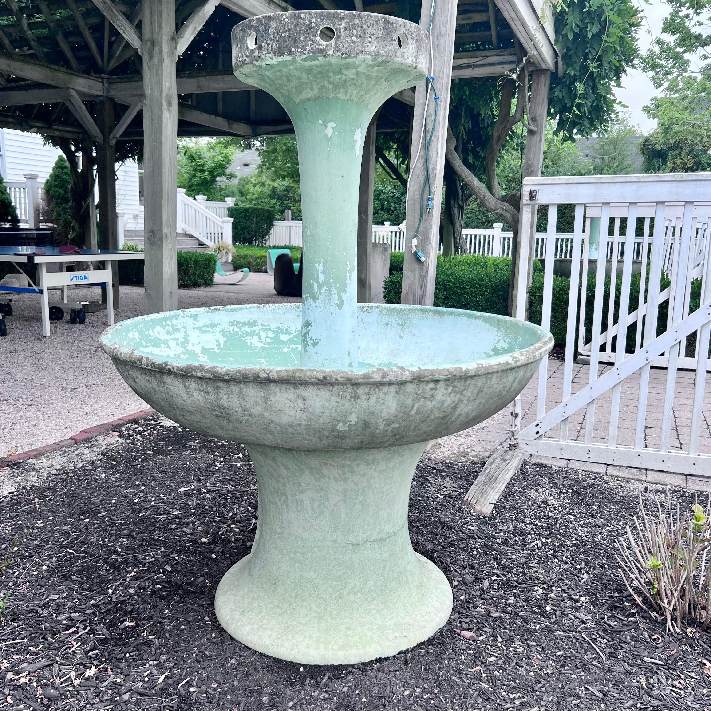 Rare concrete fountains made in Belgium. Dated March 22, 1948. Three-piece fountain with large concave base supporting massive basin and topped with a tall slender spout. Great patina and age to concrete. Factory drilled holes for water and