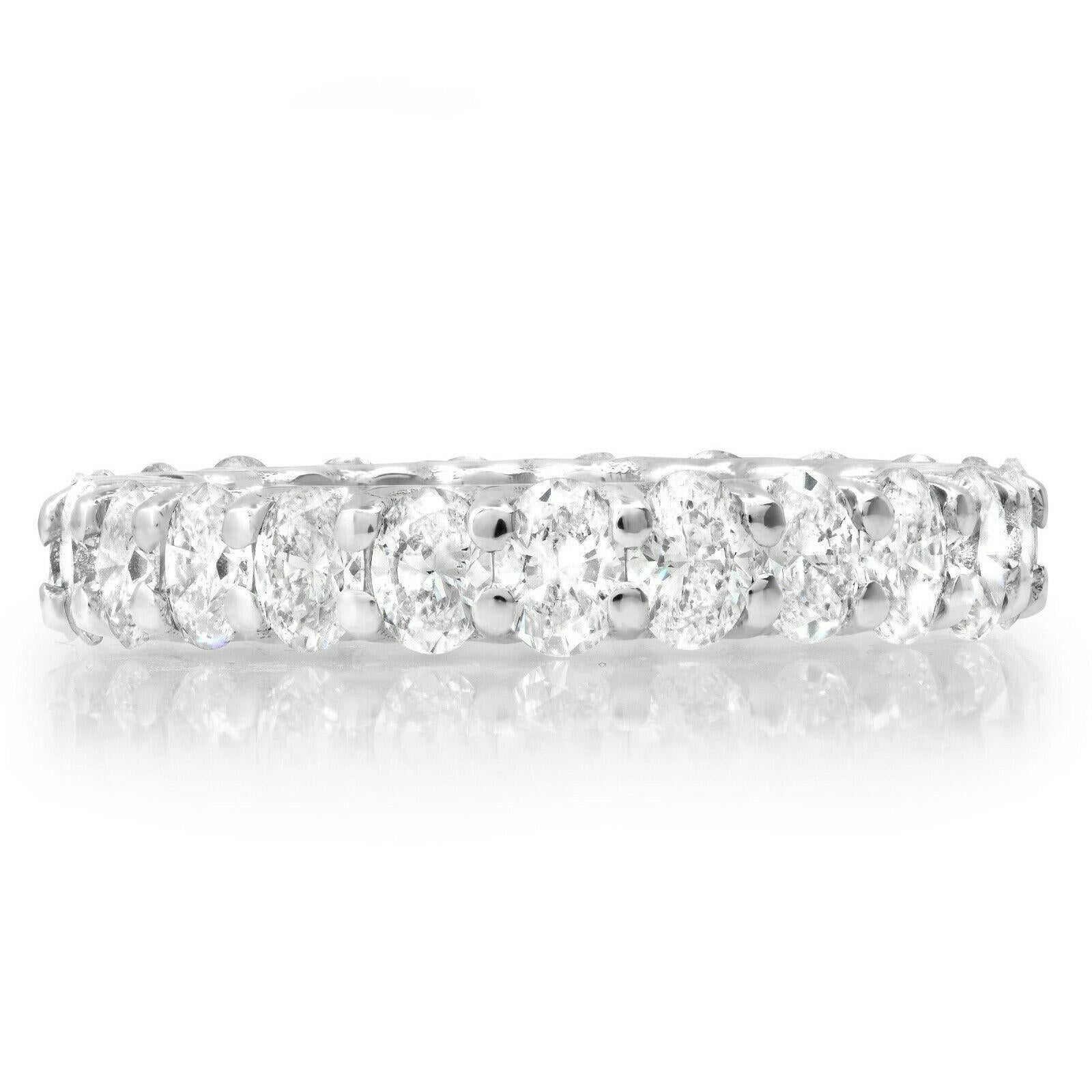 23 oval cut diamonds (3.24 total carat weight) eternity engagement ring in 18k white gold. The ring is designed and handmade locally in Los Angeles by Sage Designs L.A. using earth-mined and conflict free diamonds. The ring is 4mm wide and weighs