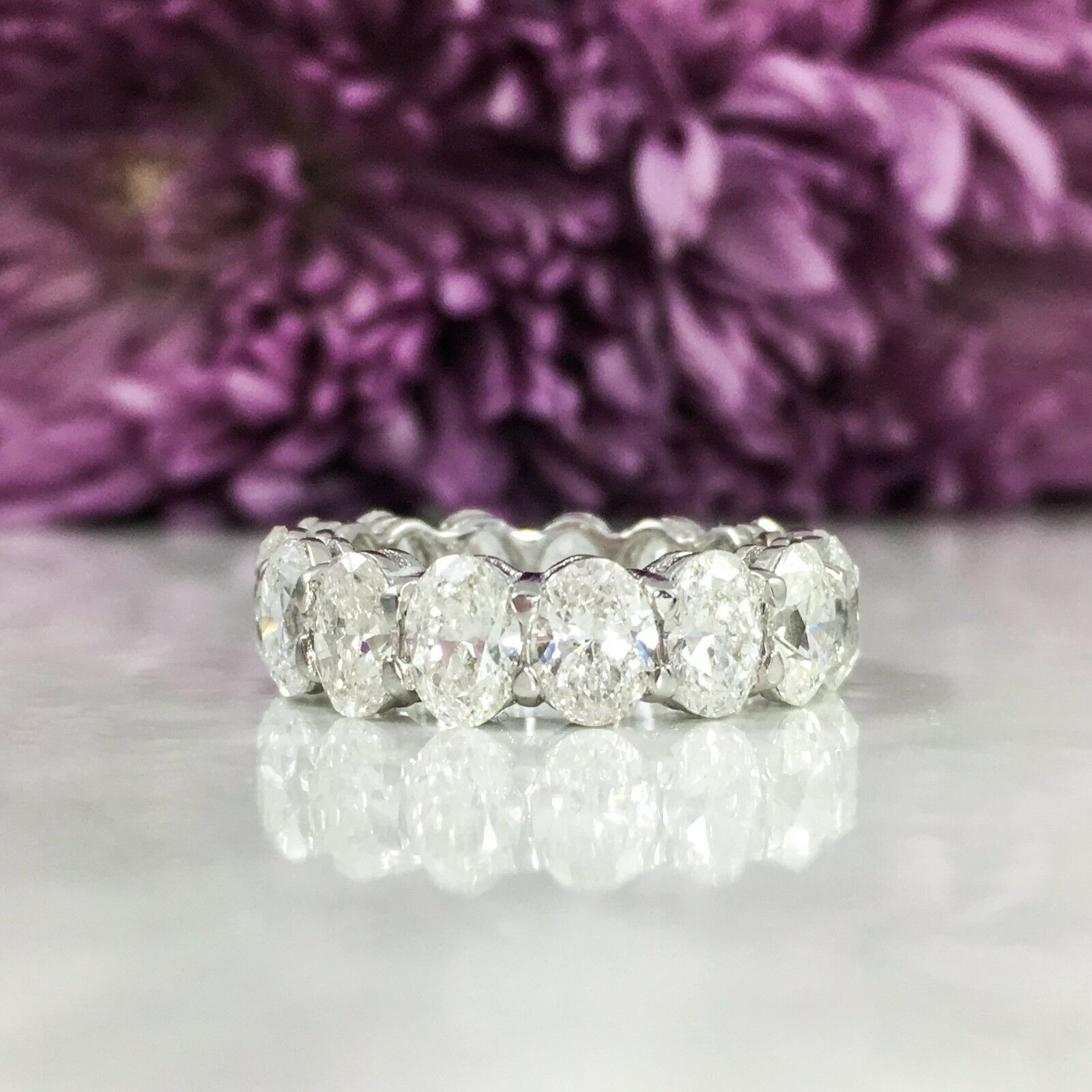 15 oval cut diamonds (7.30 total carat weight) eternity engagement ring in 18k white gold. The ring is designed and handmade locally in Los Angeles by Sage Designs L.A. using earth-mined and conflict free diamonds. The ring is 6.0mm wide and weighs
