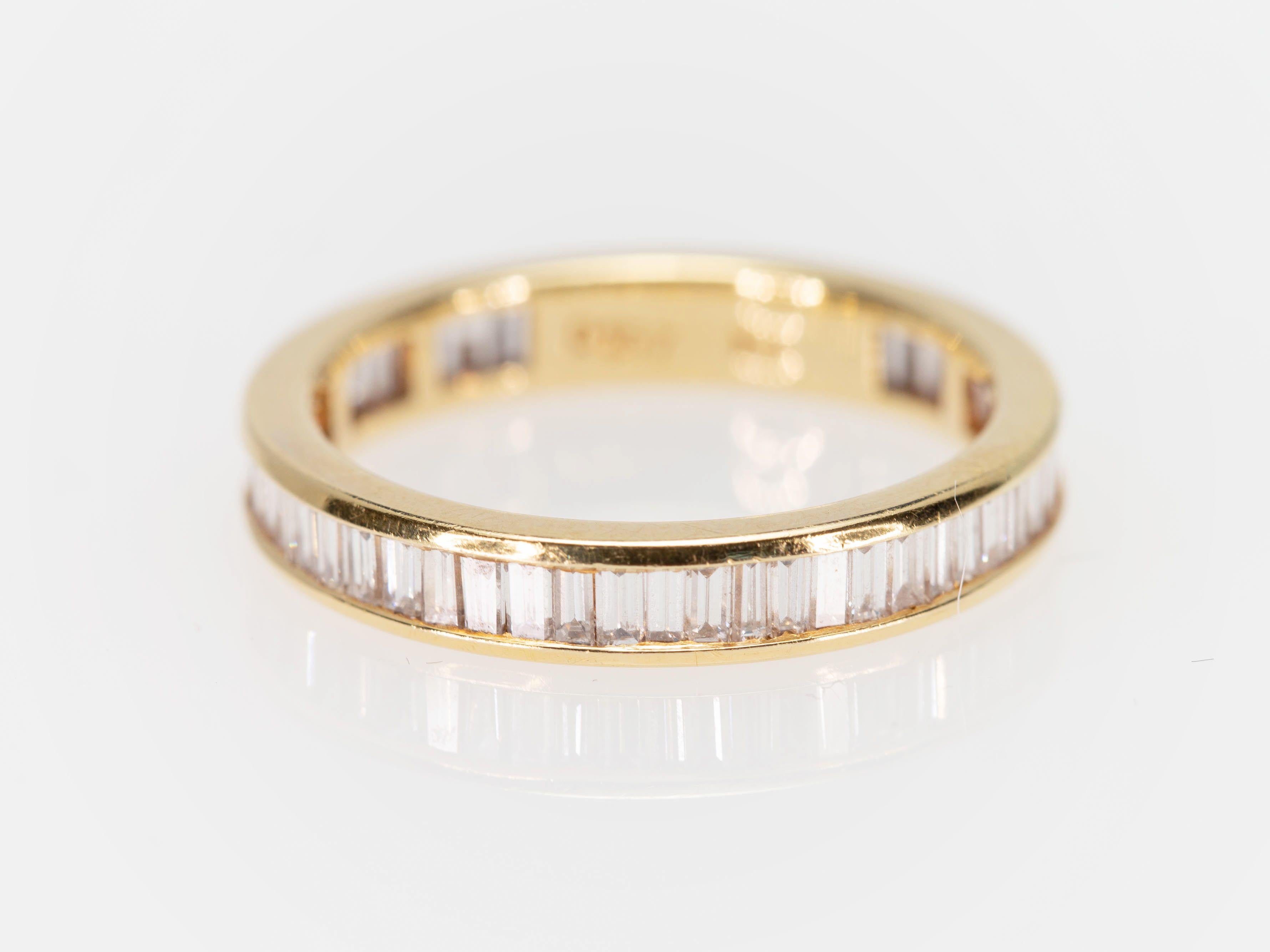 yellow gold baguette eternity ring