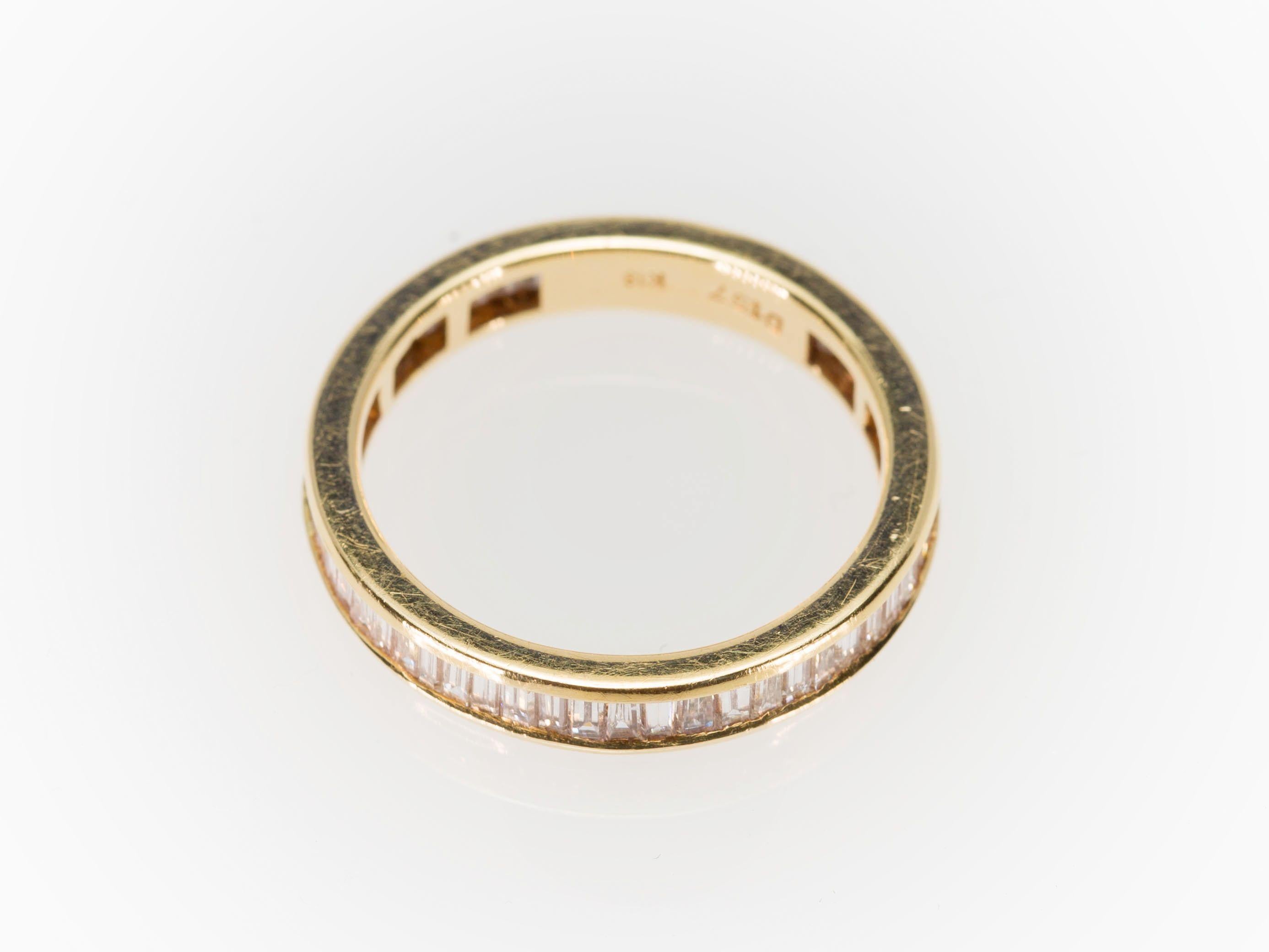 Modern Eternity Baguette Cut 1.57 Carat Diamond Band Ring in 18 Karat Yellow Gold 1980s