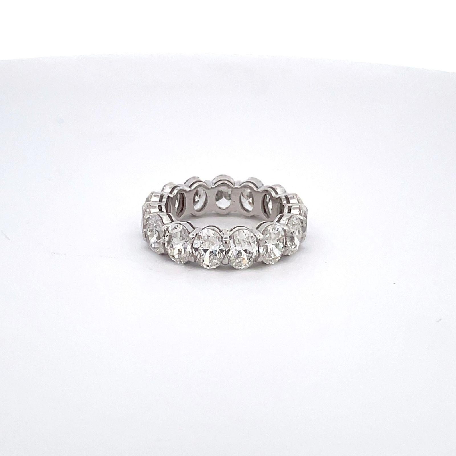 Eternity band in platinum with basket claw prong set GIA certified G-H/VS1-SI1 oval cut diamonds. D6.02ct.t.w.