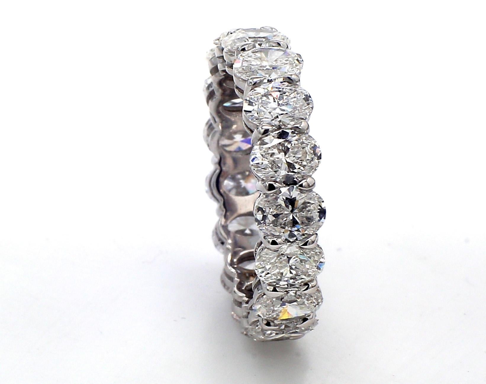 Eternity band in platinum with basket prong set oval cut diamonds. D4.10ct.t.w. - 17 stones - Size 4.75