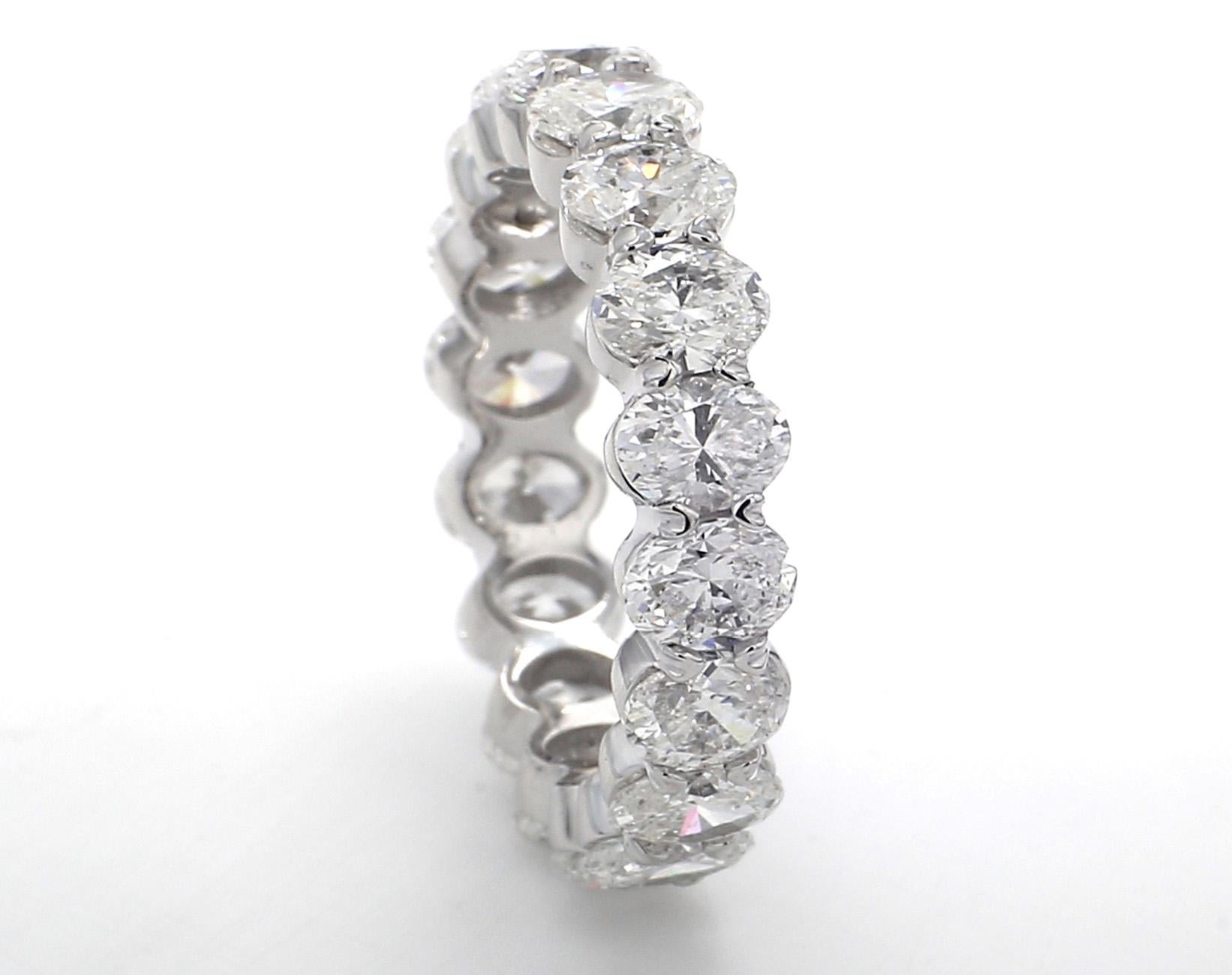 Eternity band in platinum with basket claw prong set oval diamonds. D4.27ct.t.w.