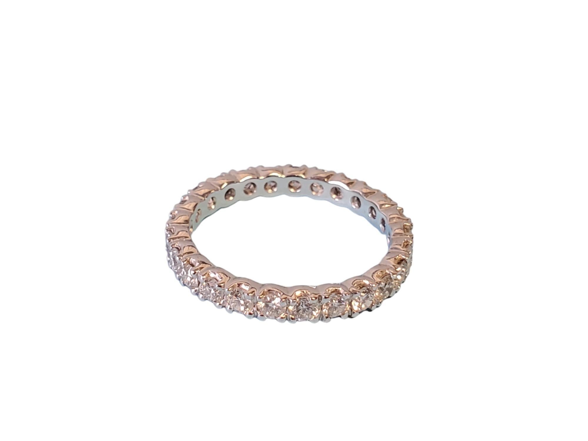 Listed is a beautiful platinum diamond eternity band with 1.14tcw white round brilliant diamonds all the way around. The stones are FG color and VS clarity that exhibit fire and scintillation. The ring is an unworn closeout piece. Take advantage and
