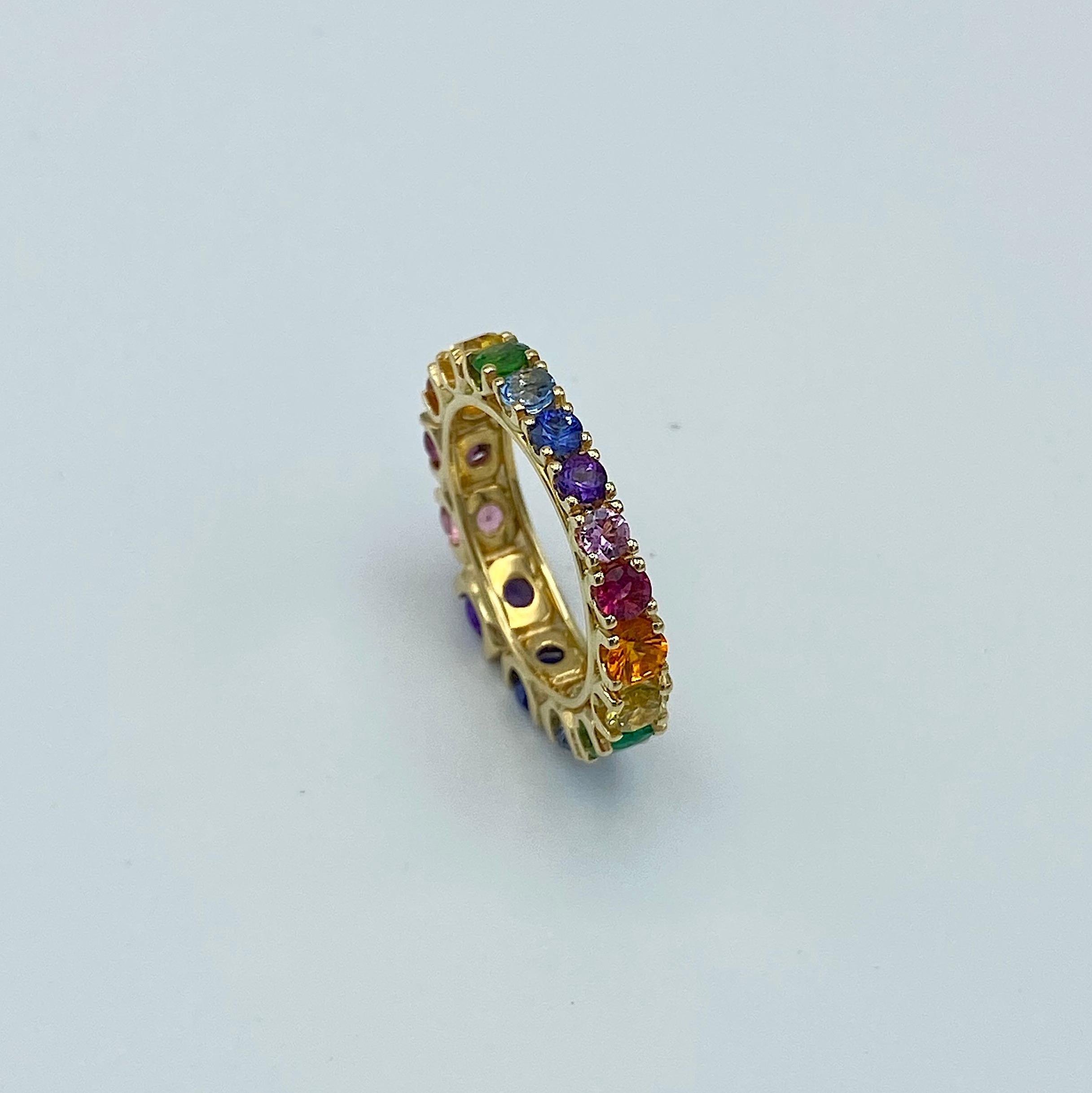 Round Cut Eternity Band Rainbow Sapphire Emerald Tzavorite Semiprecious 18 Karat Gold Ring For Sale