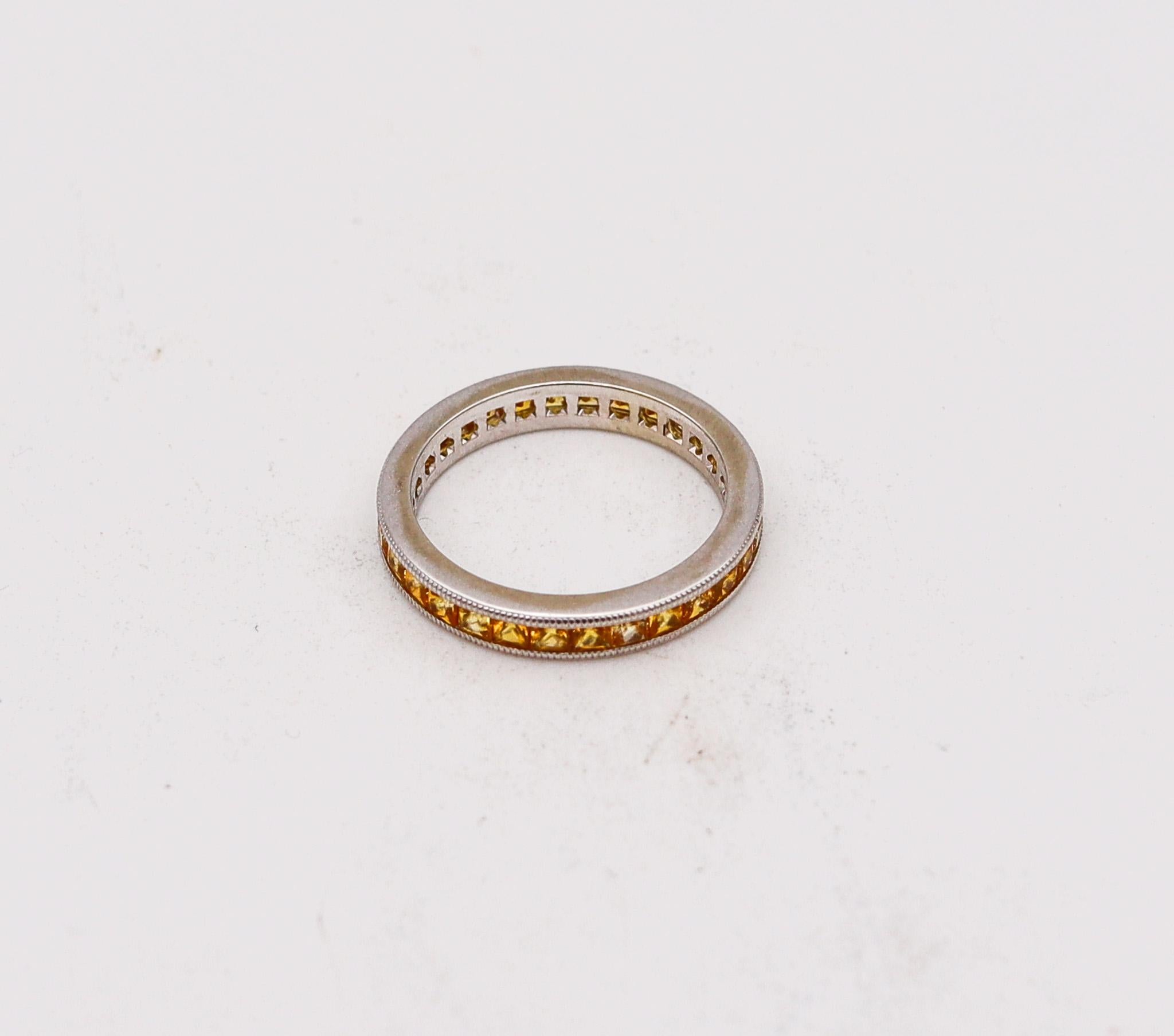 An eternity ring band with Natural Sapphires.

Modern eternity band ring crafted in solid 18 karats white gold, with high polished finish. Is mounted in a channel setting, with 30 calibrated princess cuts of vivid yellow sapphires.

Sapphires: The