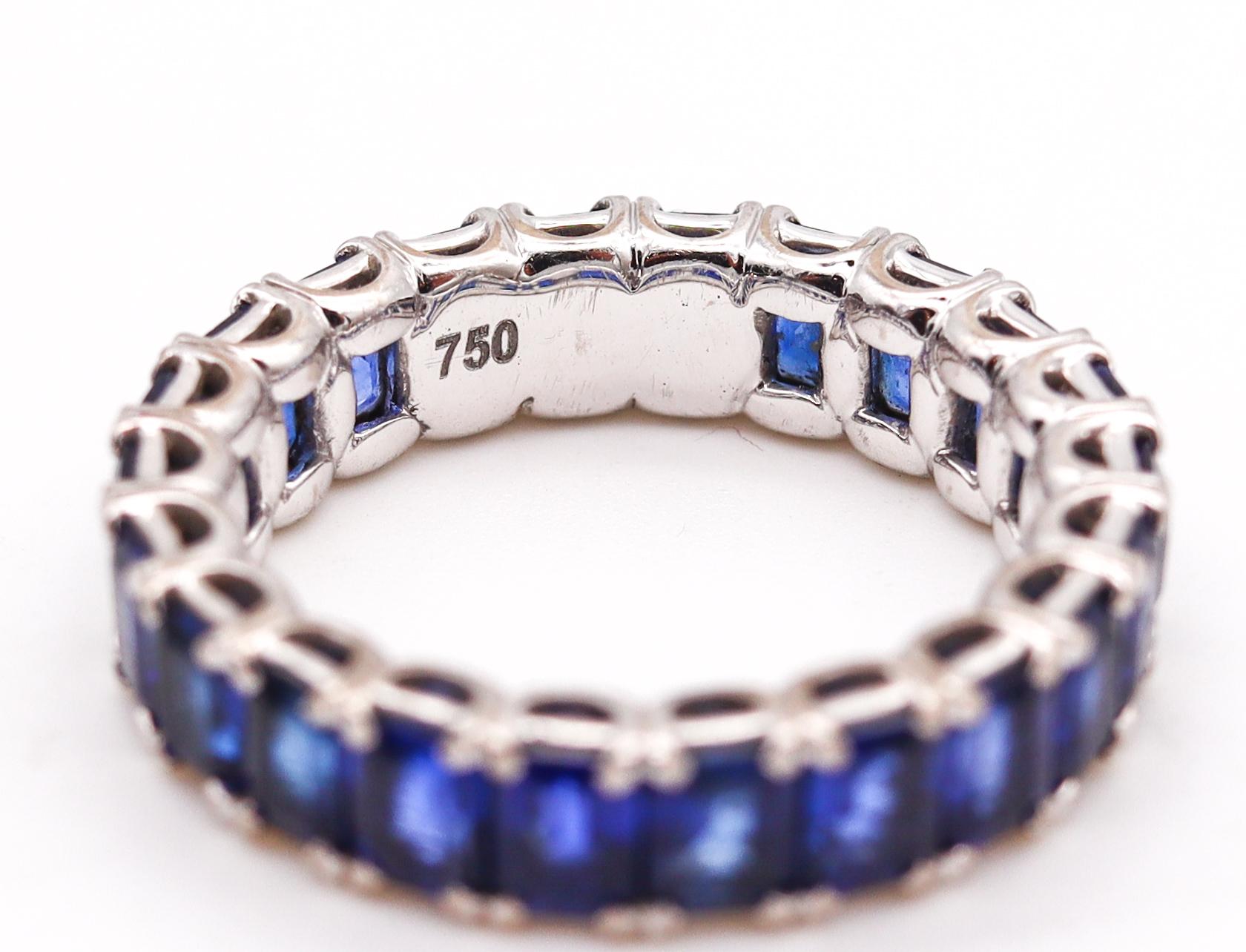 Contemporary Eternity Band Ring in 18Kt White Gold with 5.58 Cts in Vivid Blue Sapphires For Sale
