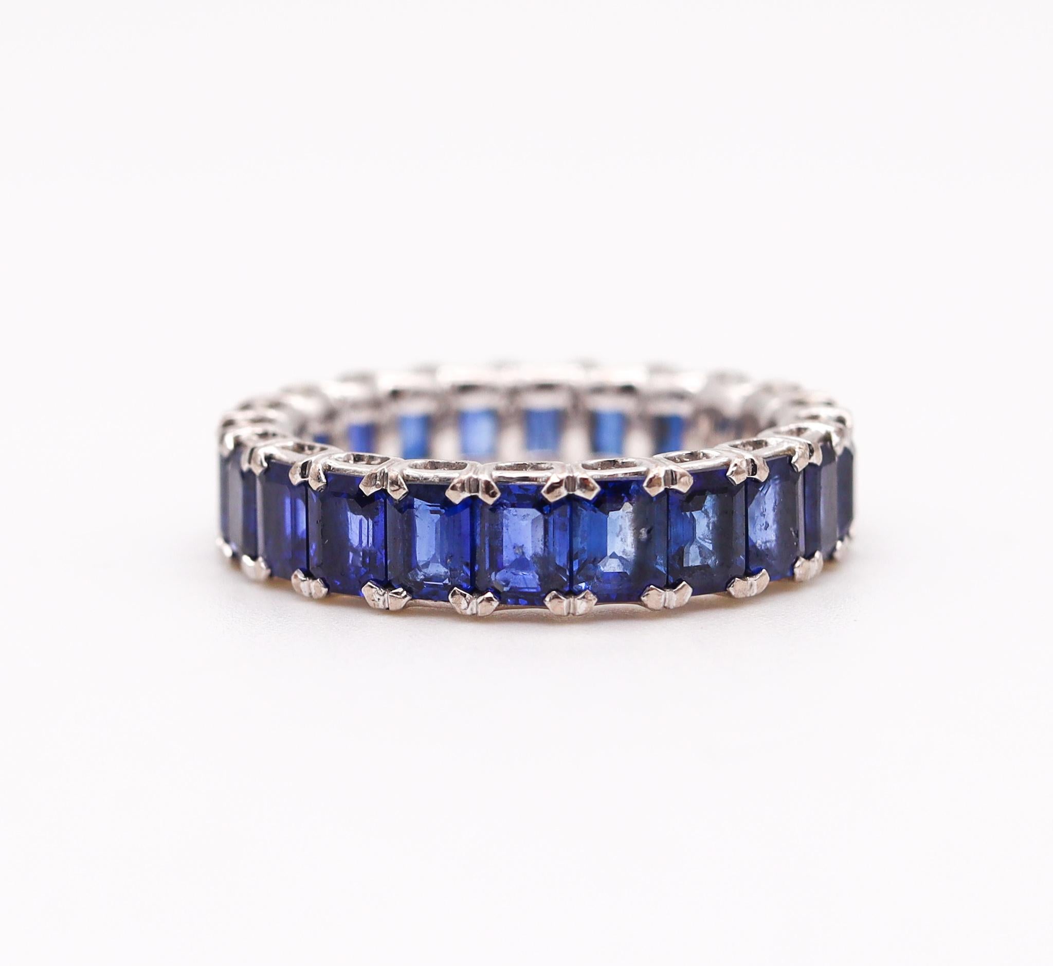 Emerald Cut Eternity Band Ring in 18Kt White Gold with 5.58 Cts in Vivid Blue Sapphires For Sale