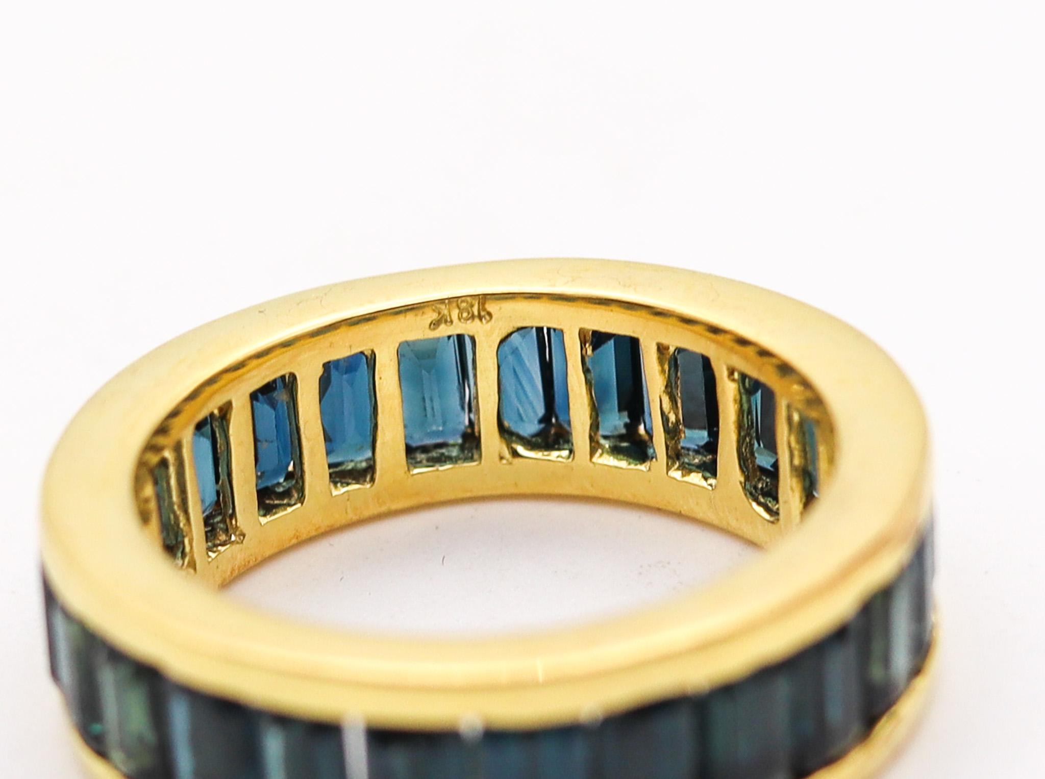 Emerald Cut Eternity Band Ring in 18 Kt White Gold with 7.24 Ctw of Natural Blue Sapphires For Sale