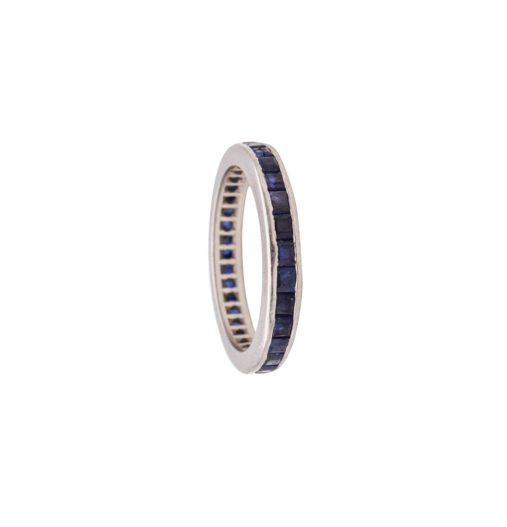 An eternity ring band with Natural Sapphires.

Modern eternity band ring crafted in solid .950/.999 platinum, with high polished finish. Is mounted in a channel setting, with 30 calibrated princess cuts of blue sapphires.

The gemstones are natural,