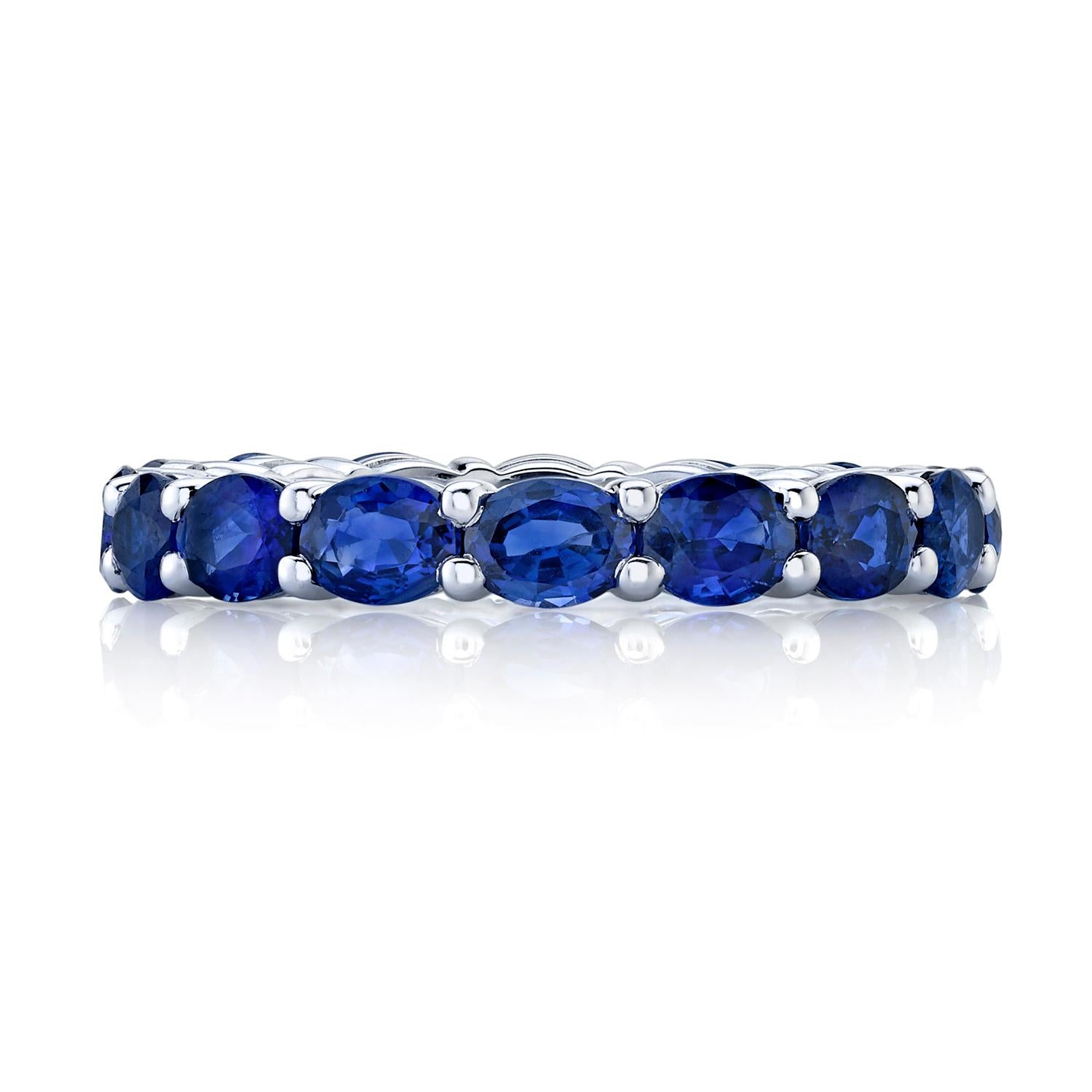 Oval shaped blue sapphires set in 18k white gold eternity band. 
16 total stones 
Carat total weight 3.85 
Ring size 6.5