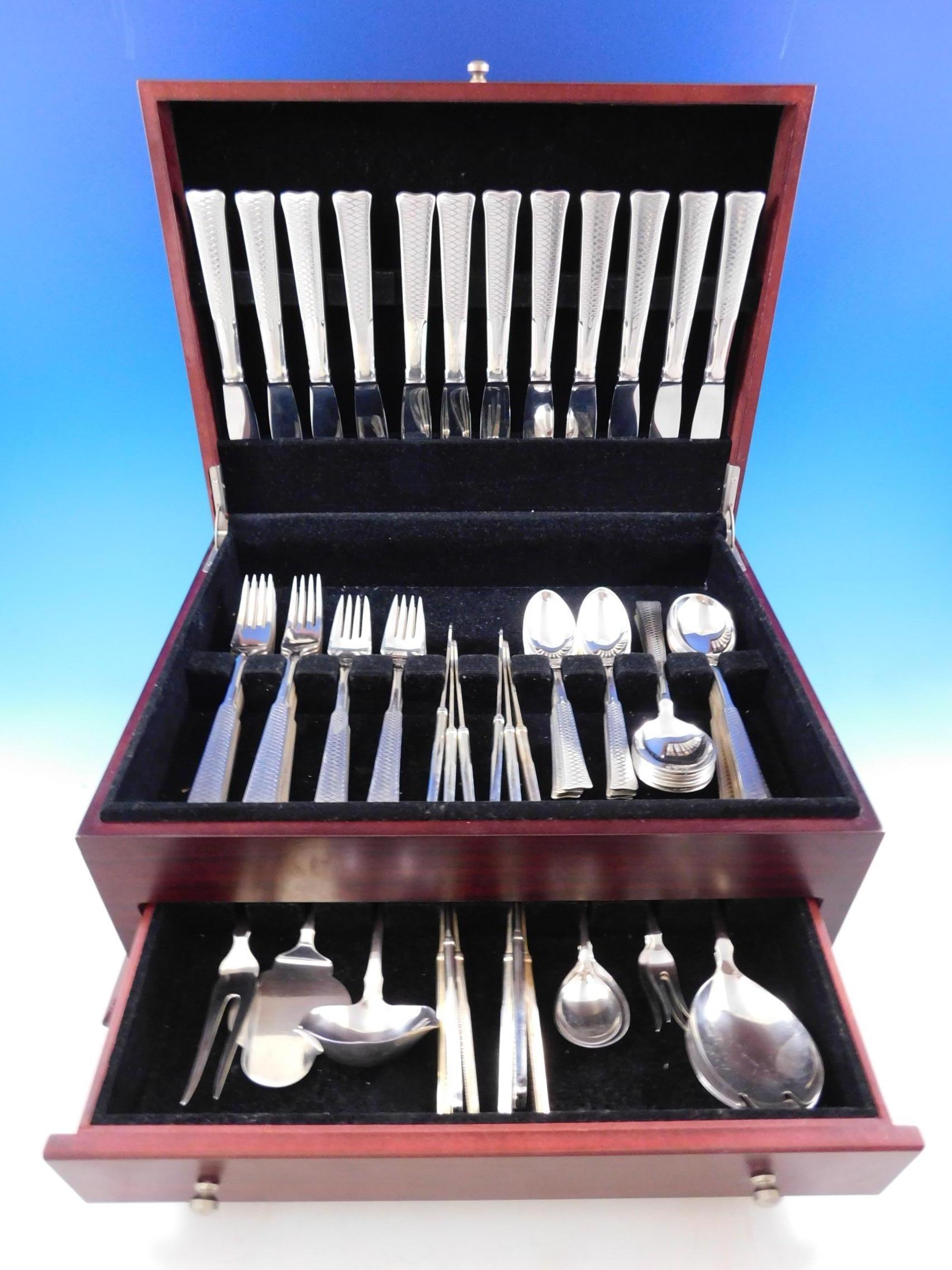 Eternity symbol by A. Dragsted Danish Mid-Century Modern sterling silver flatware set - 81 pieces. We have never seen this pattern before! The handle features a continuous eternity symbol, going down the handle. This scarce handmade set